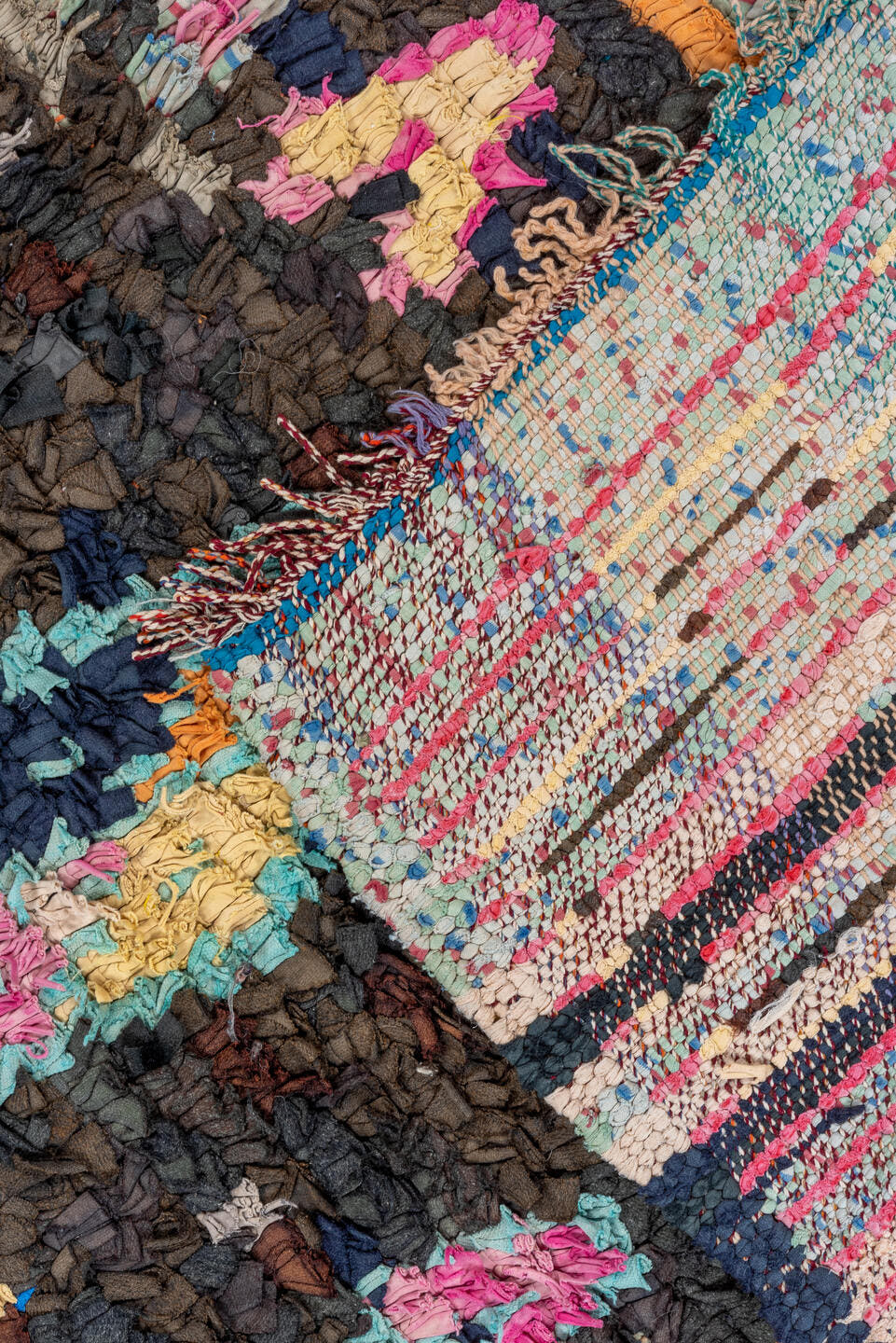 4' x 8' one-of-a-kind handmade vintage Rag Rug rug. Color palette: charcoal, hot pink, orange, turquoise, gold, cream, black
