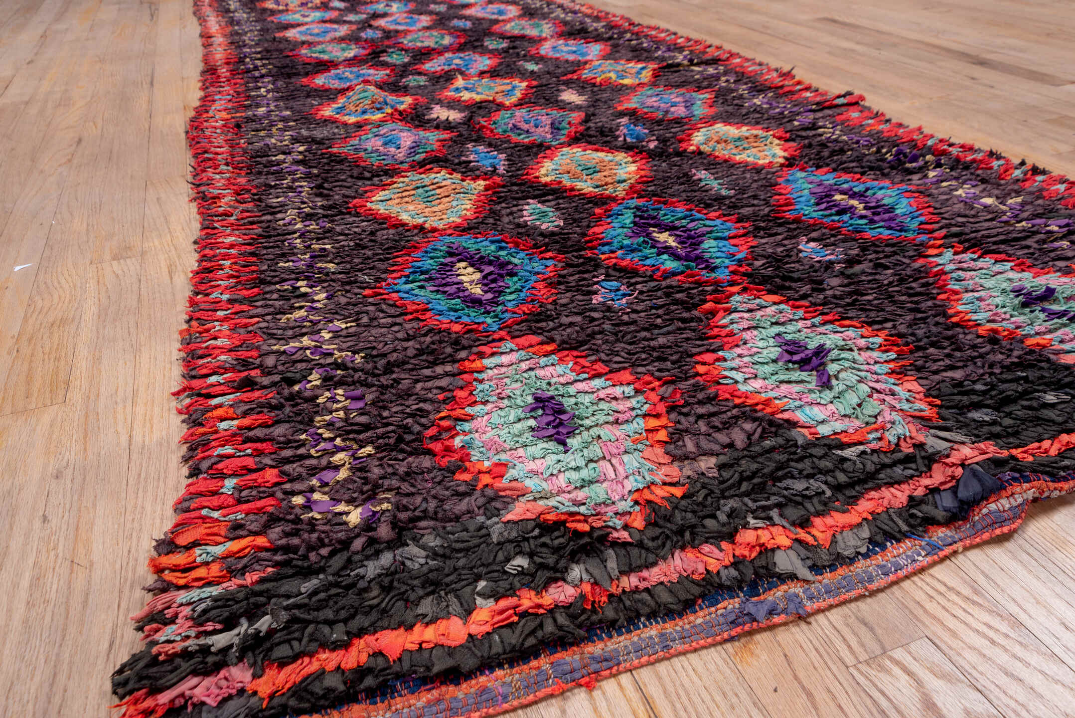 3' x 10' one-of-a-kind handmade vintage Rag Rug runner rug. Color palette: charcoal, crimson, turquoise, lavender, coral