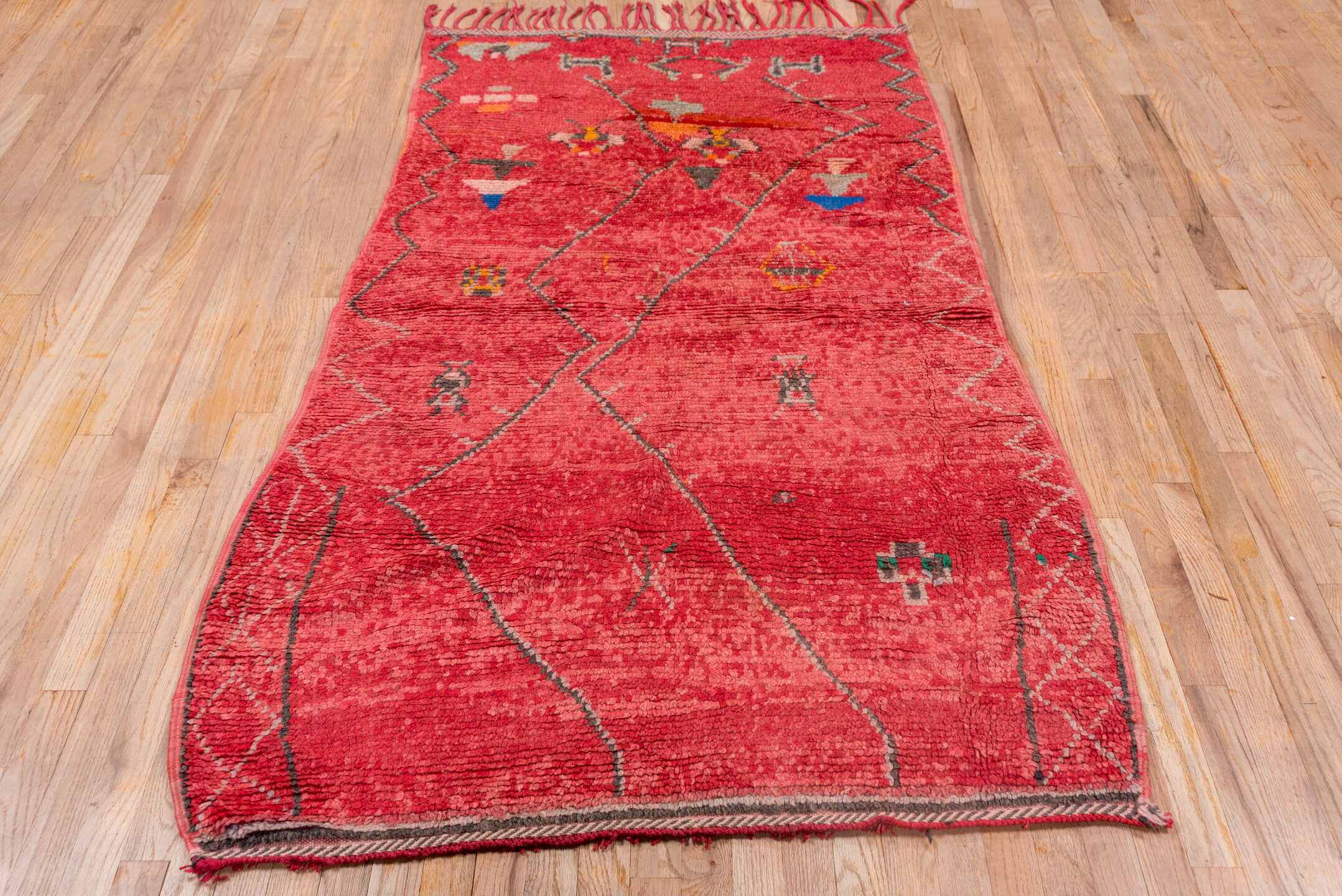 3' x 7' one-of-a-kind handmade vintage Moroccan rug. Color palette: rose, crimson, charcoal, coral, ivory, orange, cobalt
