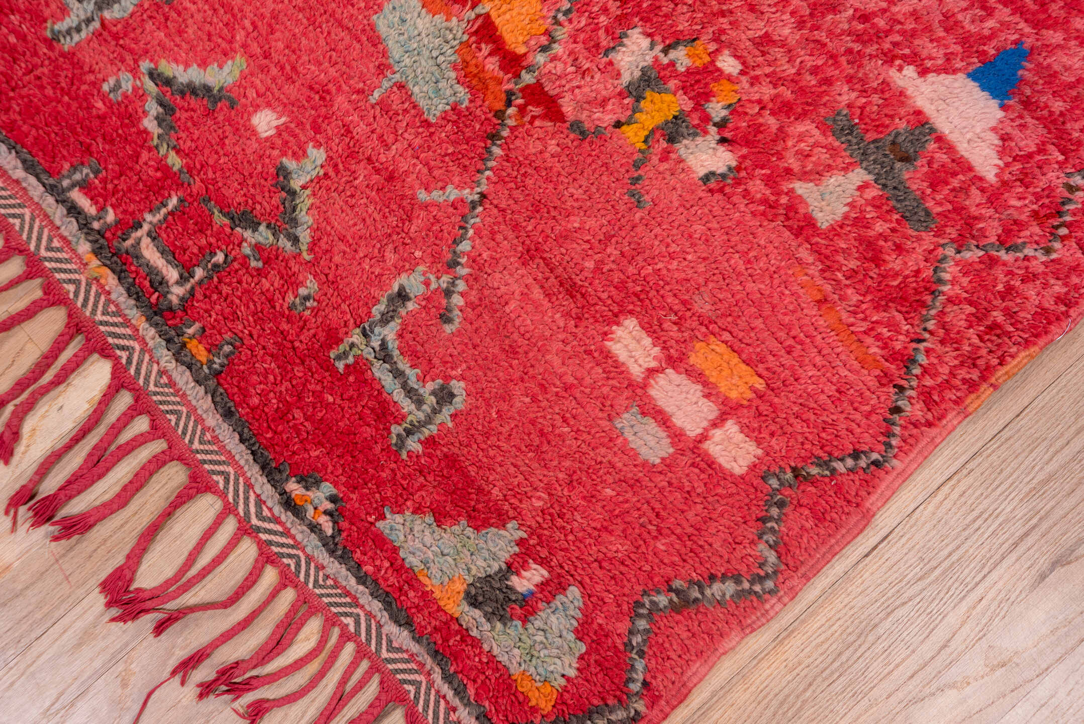 3' x 7' one-of-a-kind handmade vintage Moroccan rug. Color palette: rose, crimson, charcoal, coral, ivory, orange, cobalt