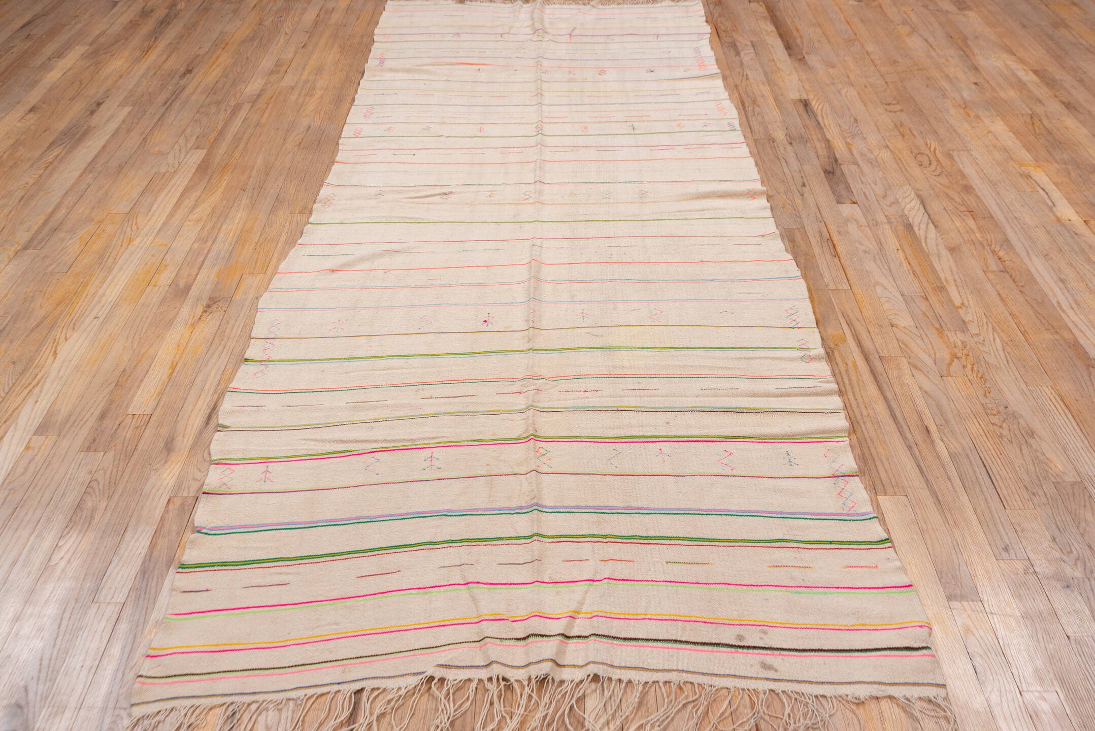 4' x 10' one-of-a-kind handmade vintage Textile runner rug. Color palette: ivory, pink, orange, gold, green, blue, taupe