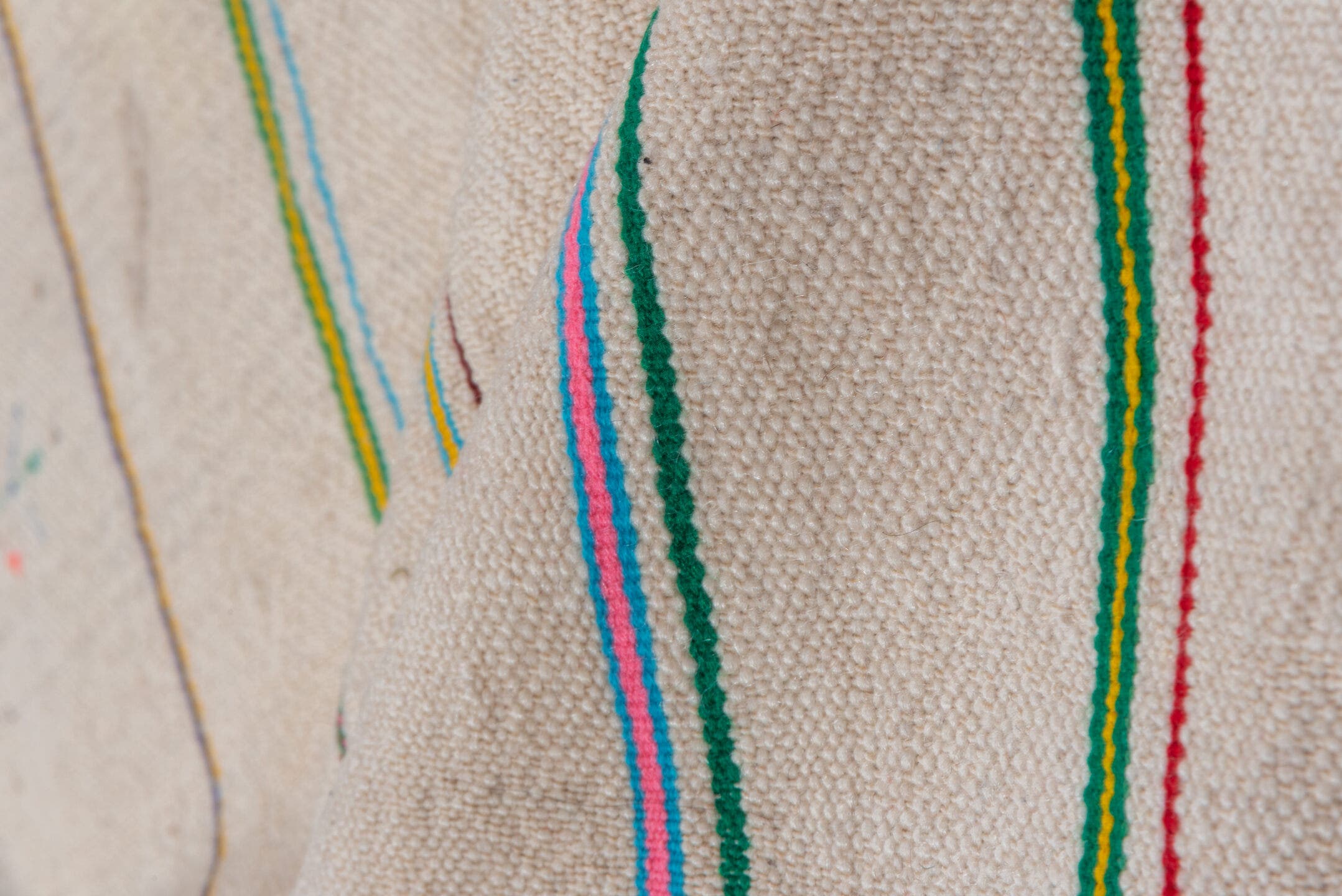 4' x 10' one-of-a-kind handmade vintage Textile runner rug. Color palette: ivory, pink, orange, gold, green, blue, taupe