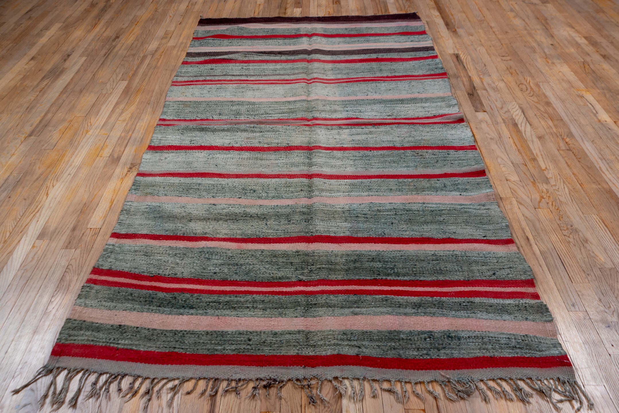 5' x 9' one-of-a-kind handmade vintage Blanket medium size rug. Color palette: gray, crimson, blush, brown, taupe, red, pink