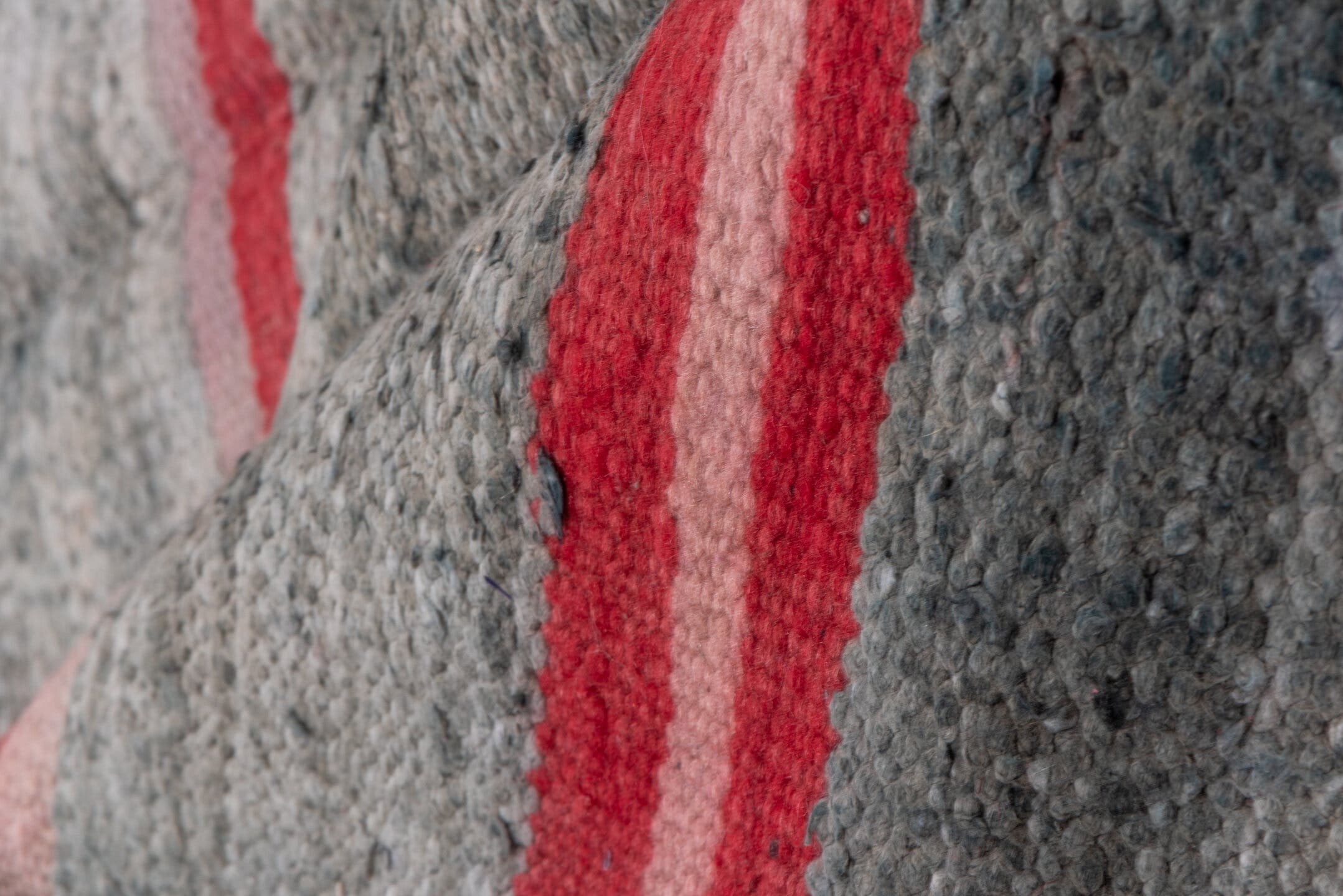 5' x 9' one-of-a-kind handmade vintage Blanket medium size rug. Color palette: gray, crimson, blush, brown, taupe, red, pink