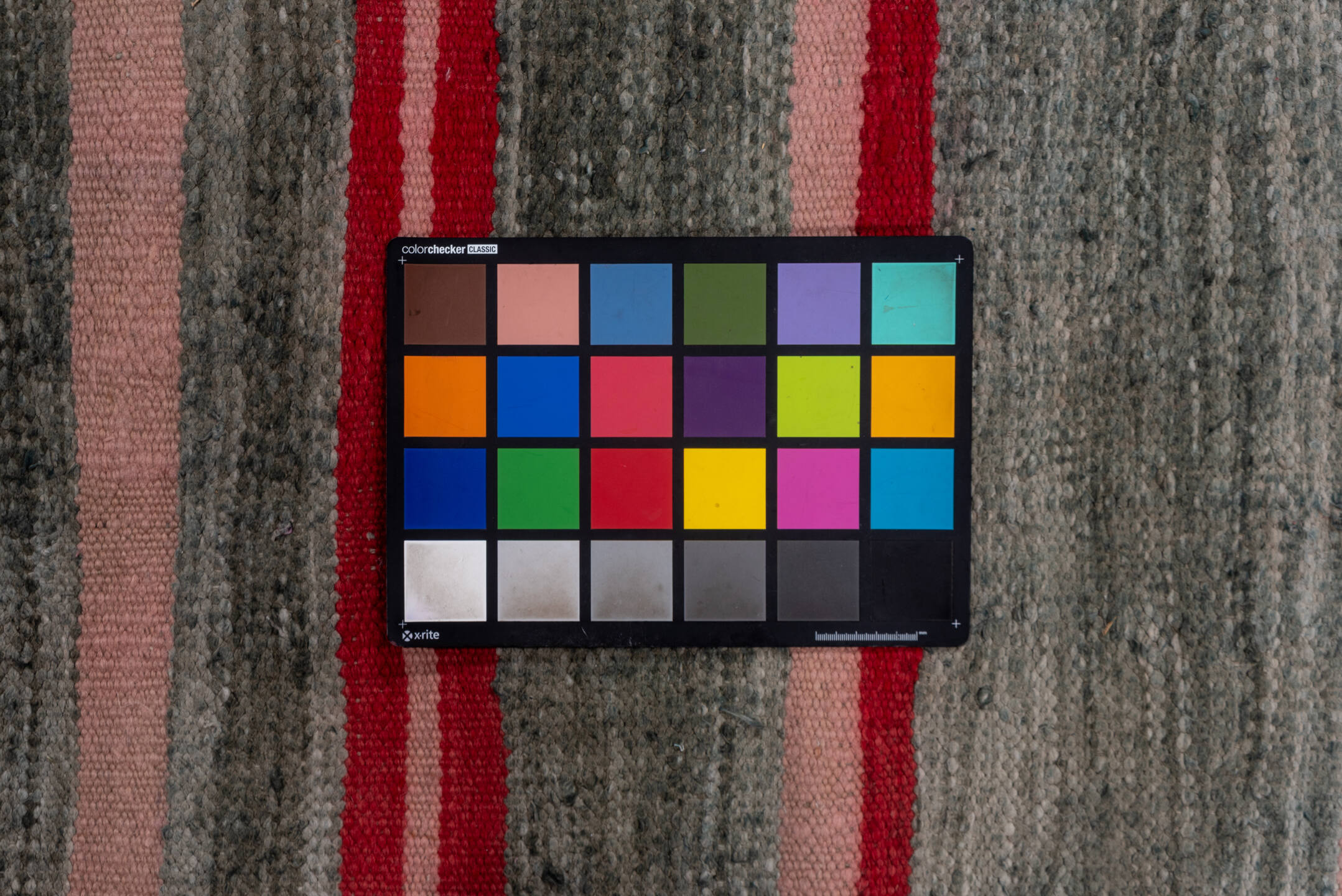 5' x 9' one-of-a-kind handmade vintage Blanket medium size rug. Color palette: brown, gray, light gray, off-white, pink, red