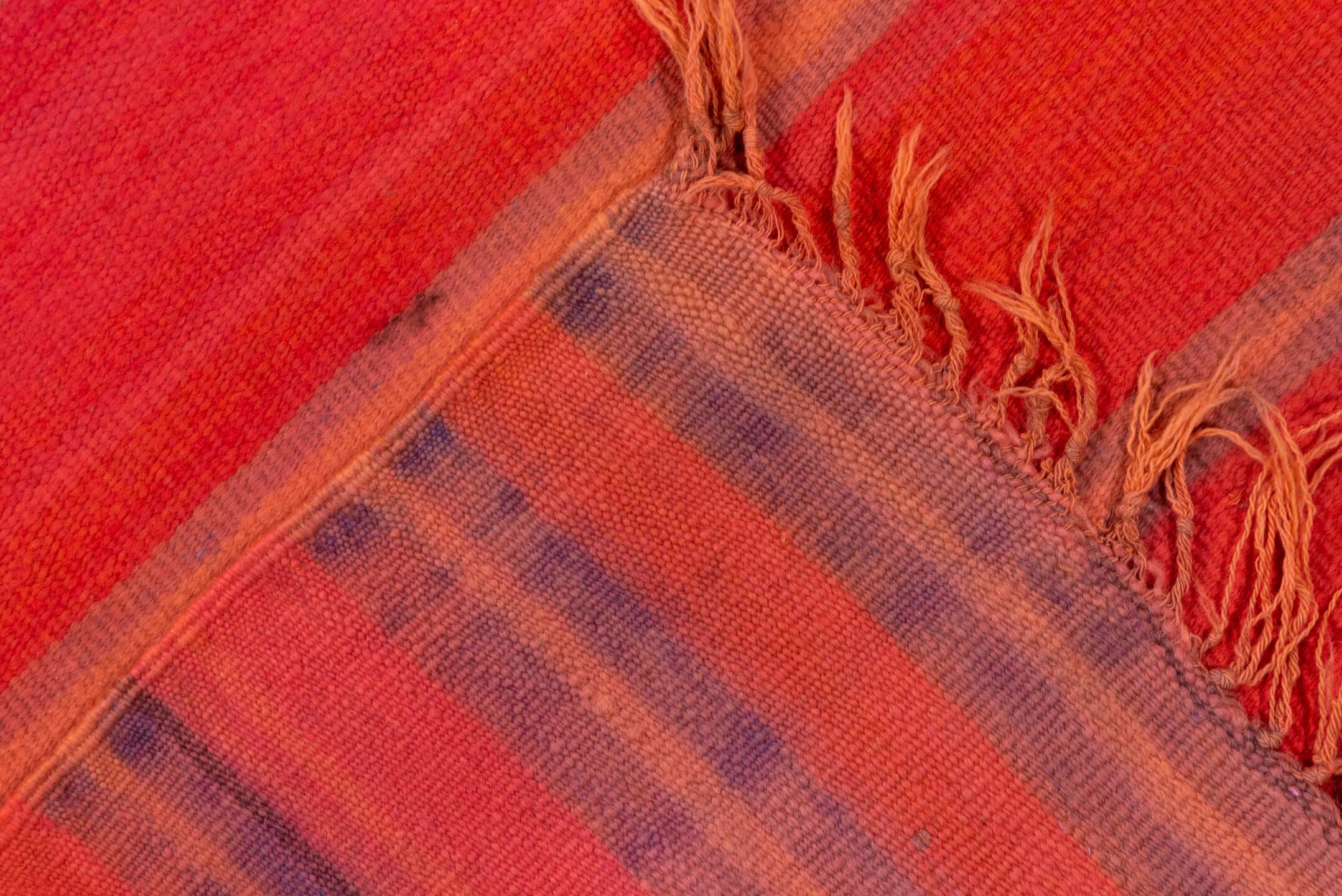5' x 12' one-of-a-kind handmade vintage Blanket rug. Color palette: rose, crimson, terra cotta, taupe, plum, pink, red