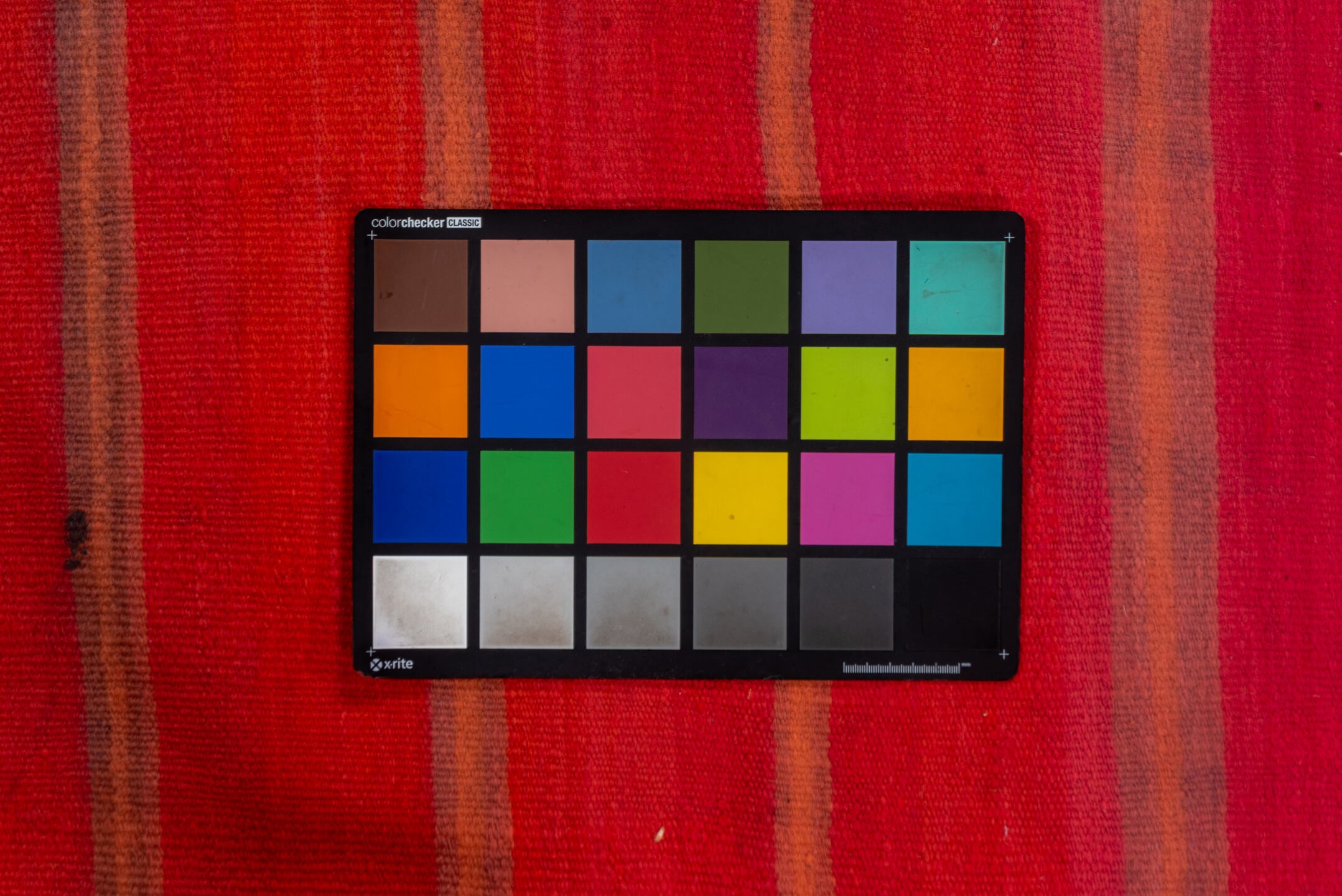 5' x 12' one-of-a-kind handmade vintage Blanket rug. Color palette: brown, indian red, off-white, pink, red, snow, white