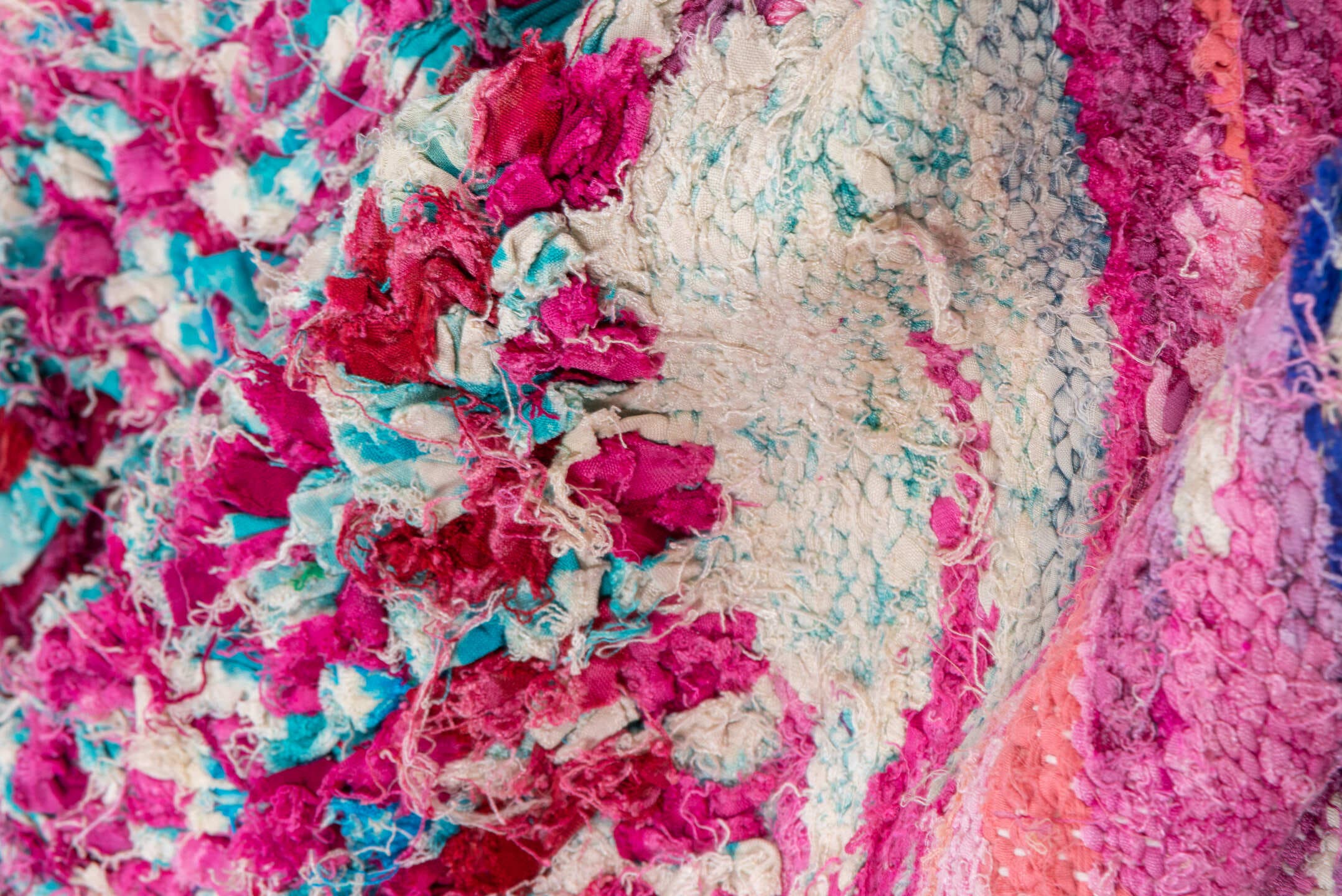 4' x 9' one-of-a-kind handmade vintage Rag Rug rug. Color palette: pink, turquoise, ivory, burgundy, rose, taupe, gold, teal