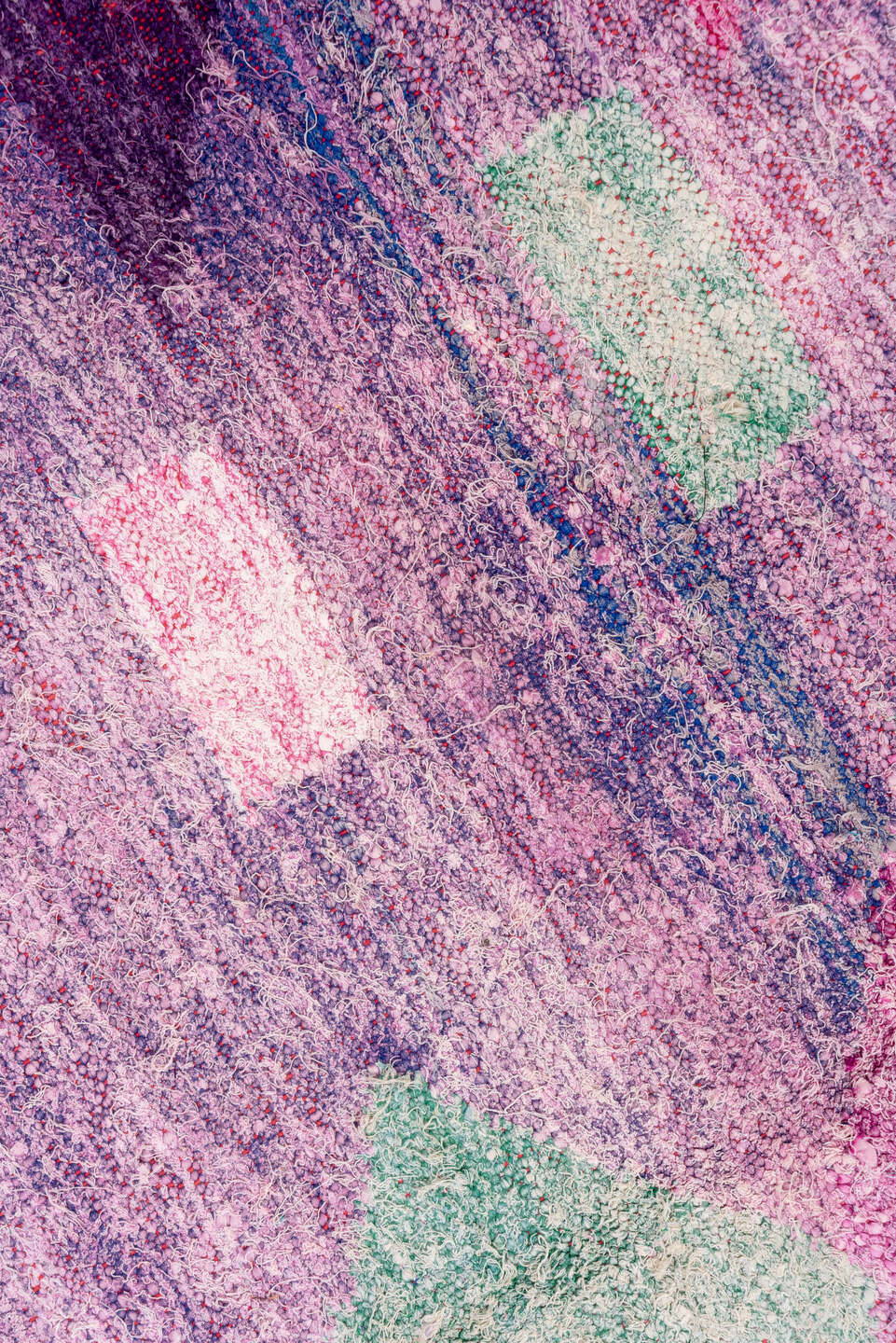 4' x 8' one-of-a-kind handmade vintage Rag Rug rug. Color palette: lavender, plum, pink, aqua, raspberry, mint, peach, ivory