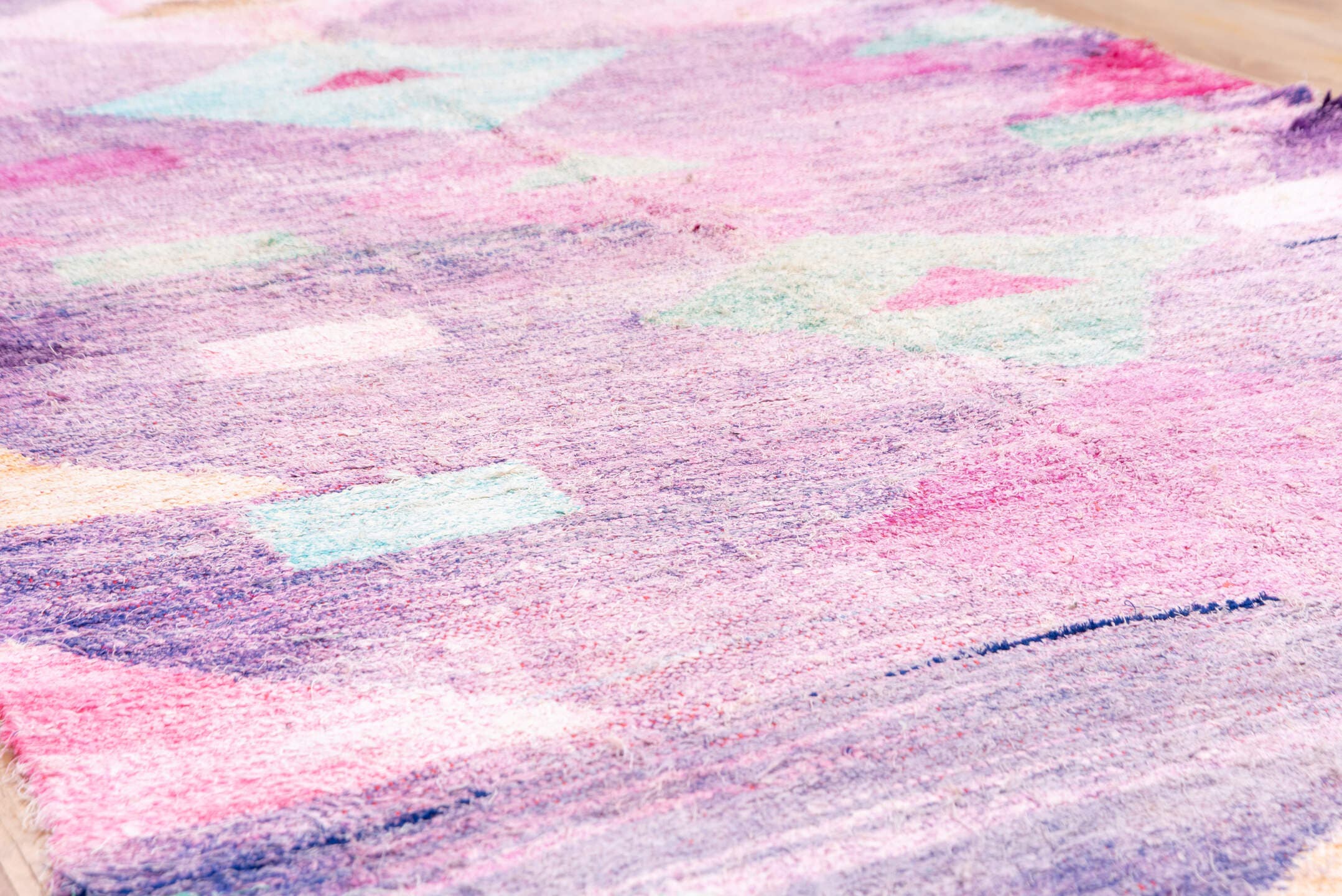 4' x 8' one-of-a-kind handmade vintage Rag Rug rug. Color palette: lavender, plum, pink, aqua, raspberry, mint, peach, ivory