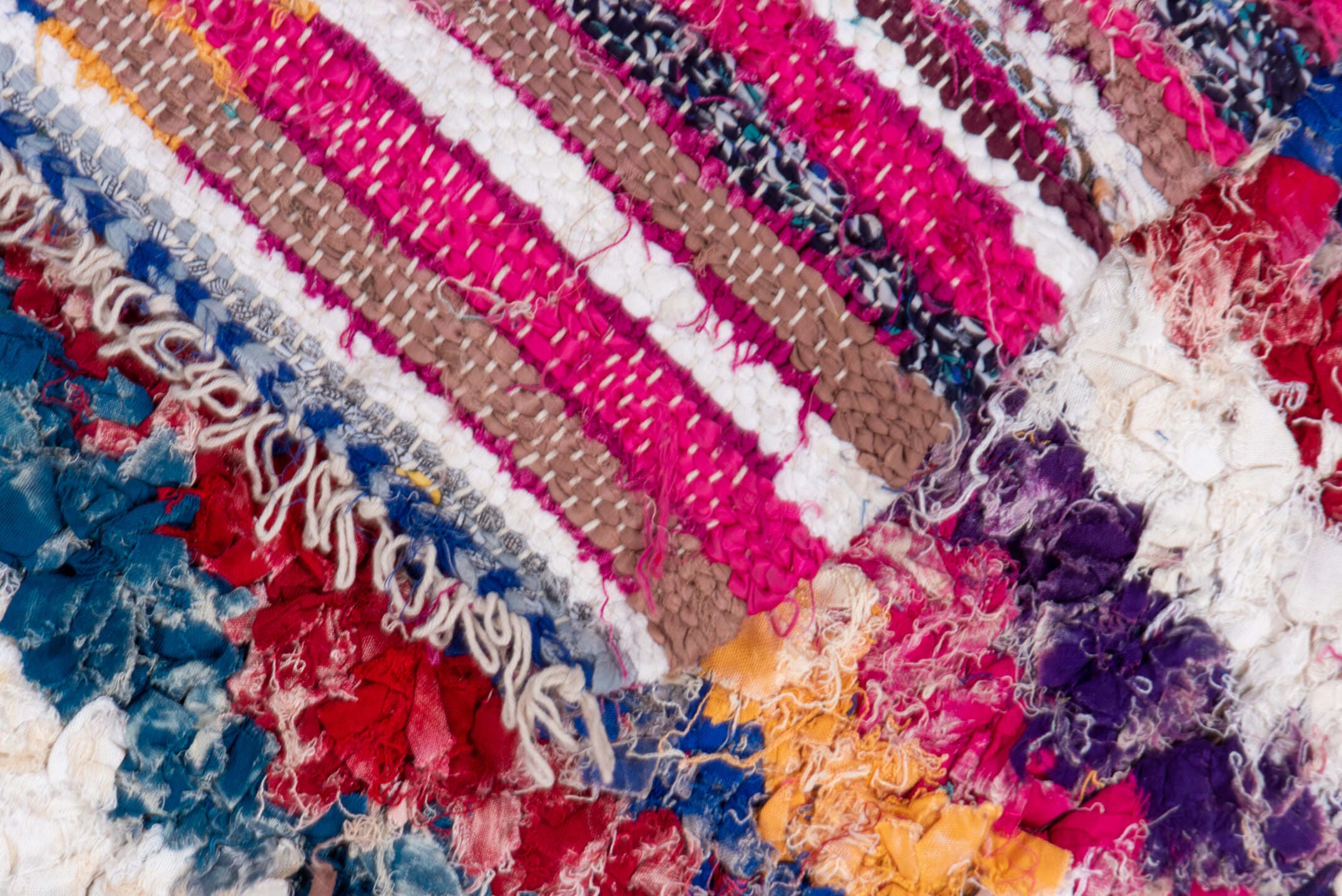 4' x 8' one-of-a-kind handmade vintage Rag Rug rug. Color palette: ivory, magenta, turquoise, cobalt, black, rose, lavender