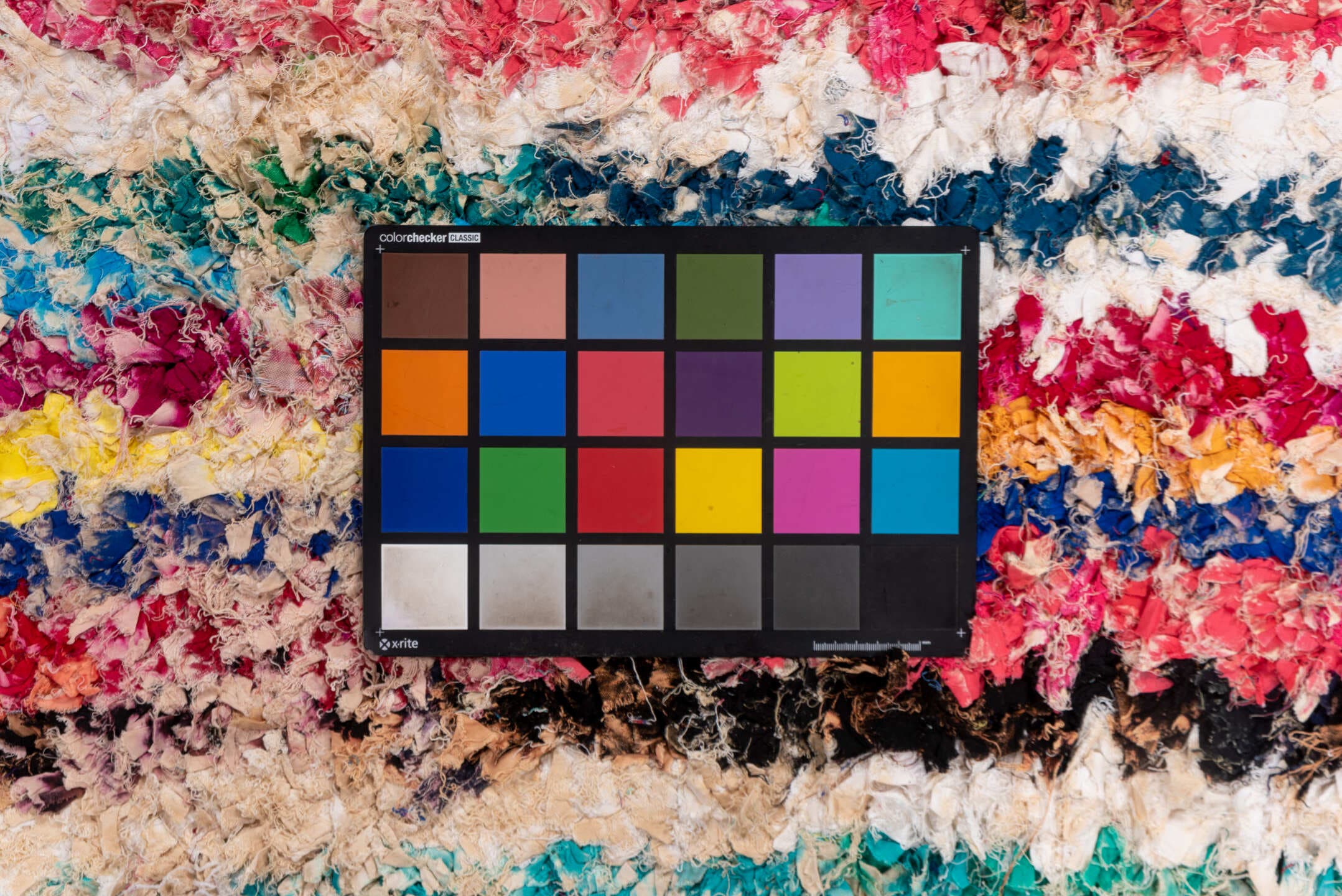 4' x 8' one-of-a-kind handmade vintage Rag Rug rug. Color palette: ivory, magenta, turquoise, cobalt, black, rose, lavender
