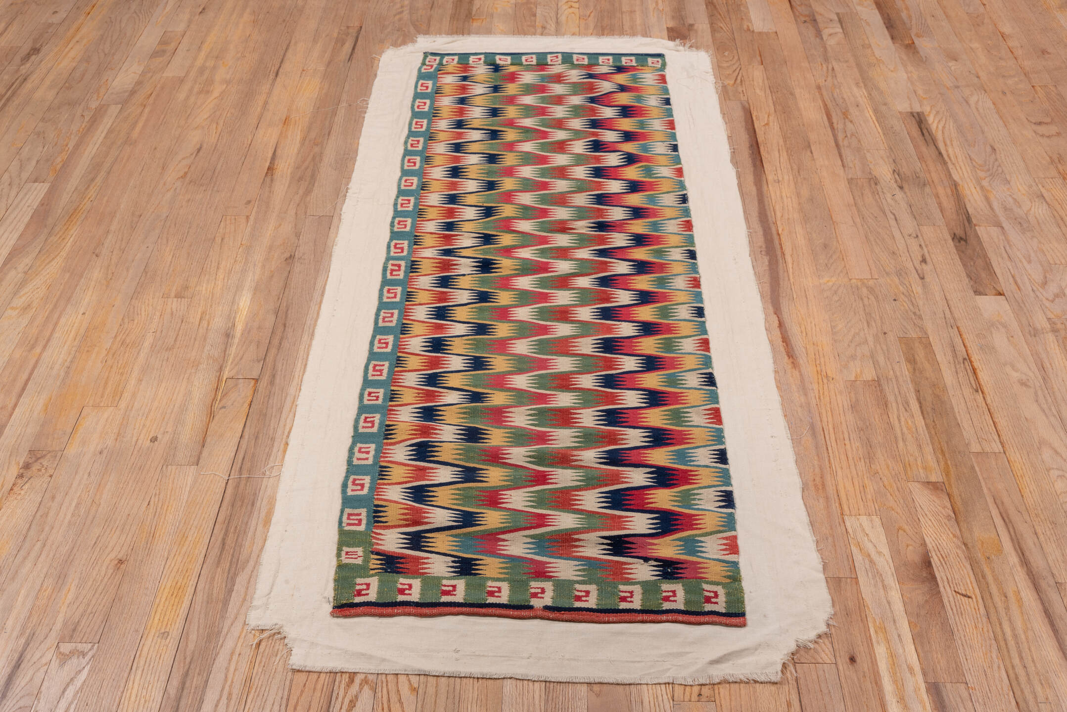 2' x 5' one-of-a-kind handmade vintage Rollaken small size rug. Color palette: blue, brown, gray, off-white, orange, pink