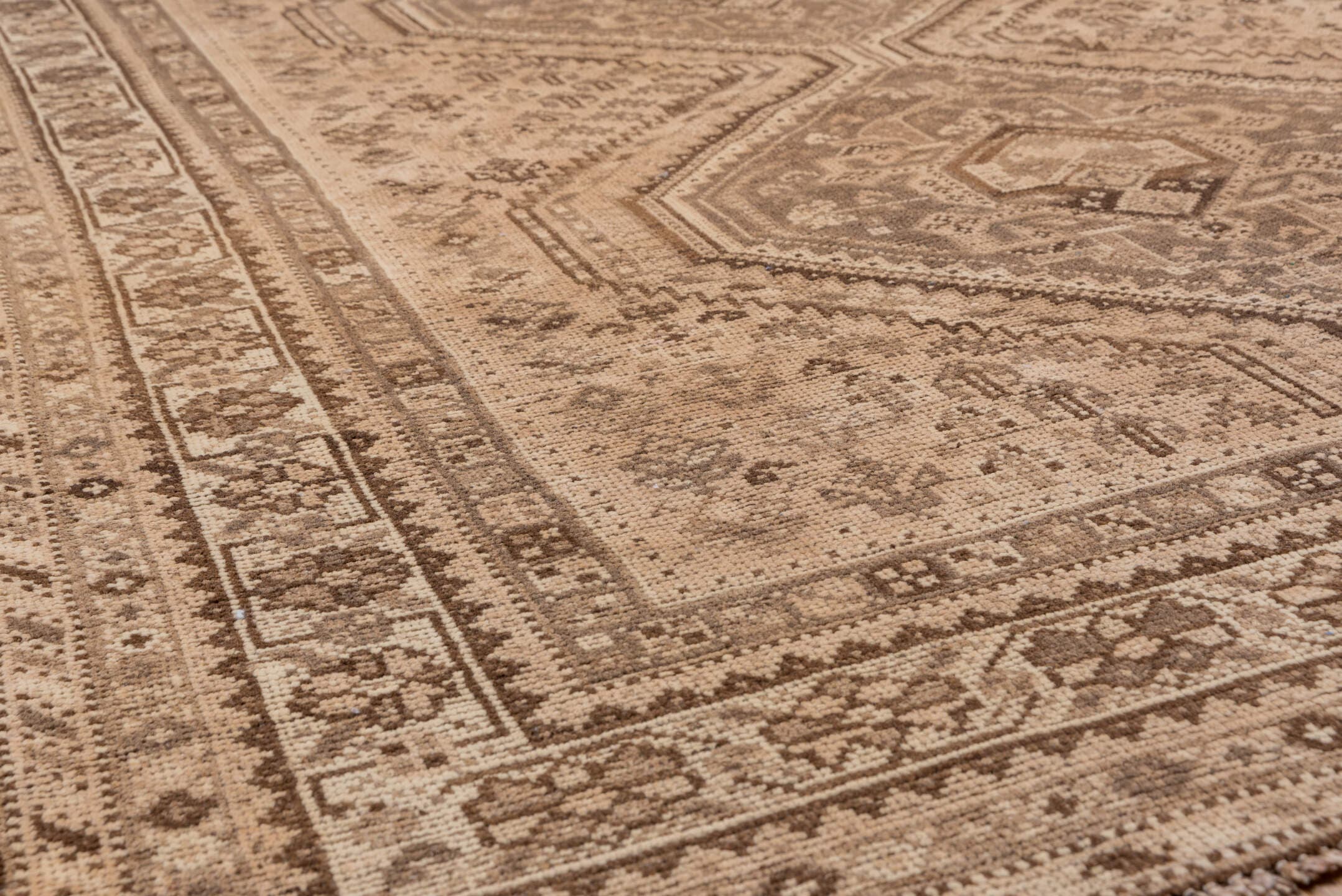 5' x 6' one-of-a-kind handmade antique Shiraz rug. Color palette: camel, taupe, brown, beige, ivory, gray