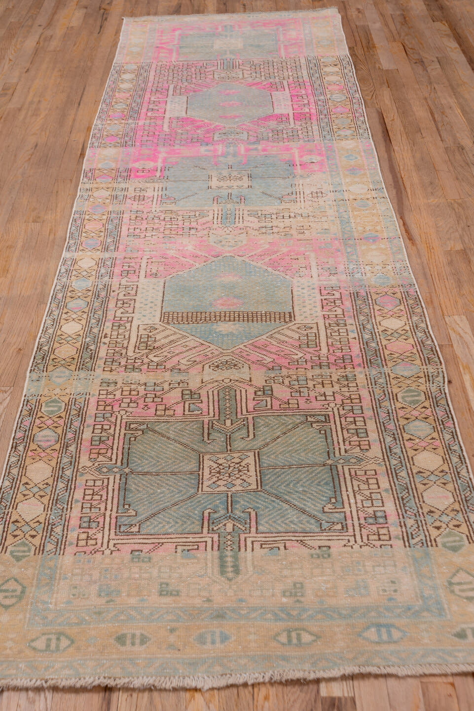 3' x 11' one-of-a-kind handmade antique Sarab runner rug. Color palette: ivory, sky blue, pink, camel, taupe, charcoal