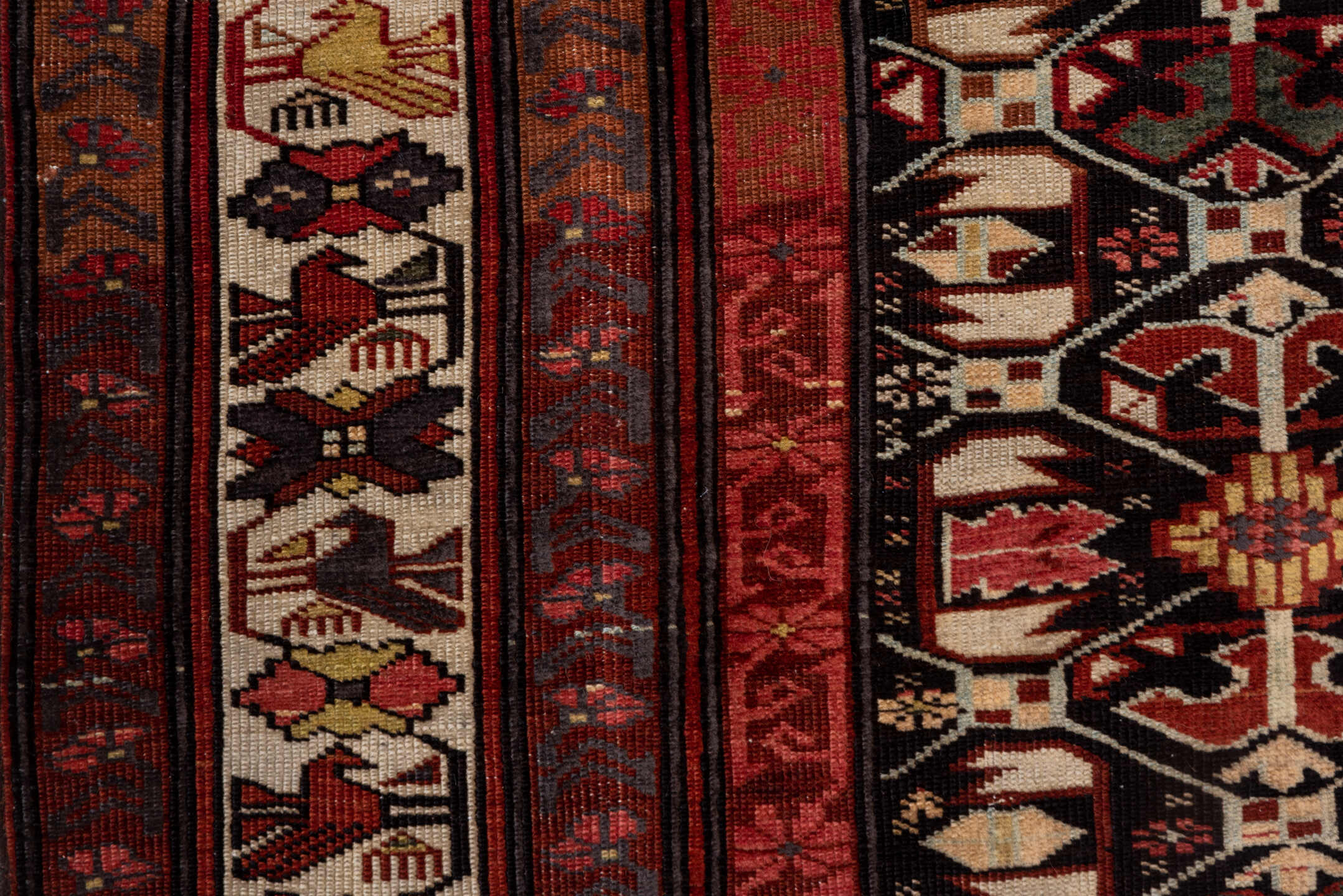 4' x 7' one-of-a-kind handmade antique Kuba rug. Color palette: burgundy, ivory, charcoal, rust, crimson, gold, taupe, gray