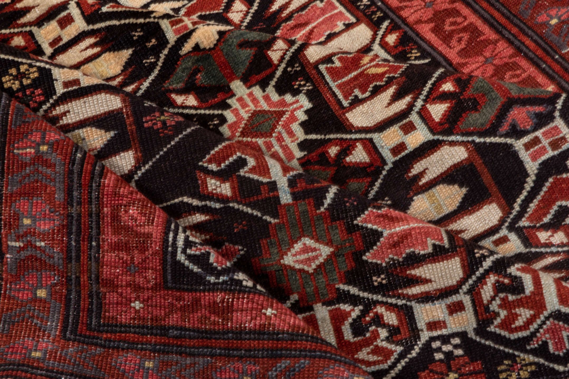 4' x 7' one-of-a-kind handmade vintage Kuba rug. Color palette: black, brown, gray, pink, red