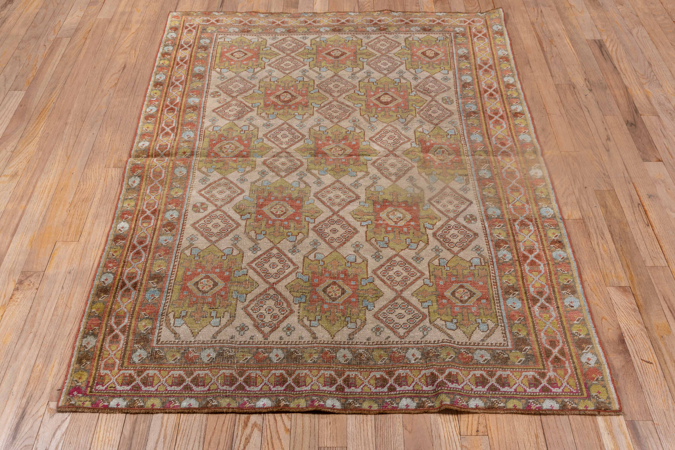 4' x 5' one-of-a-kind handmade antique Afshar small size rug. Color palette: ivory, rust, olive, terra cotta, sky blue