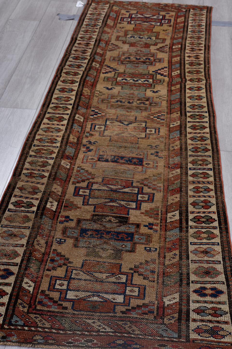 2' x 8' one-of-a-kind handmade antique NW Persian runner rug. Color palette: ivory, rust, indigo, camel, taupe, charcoal