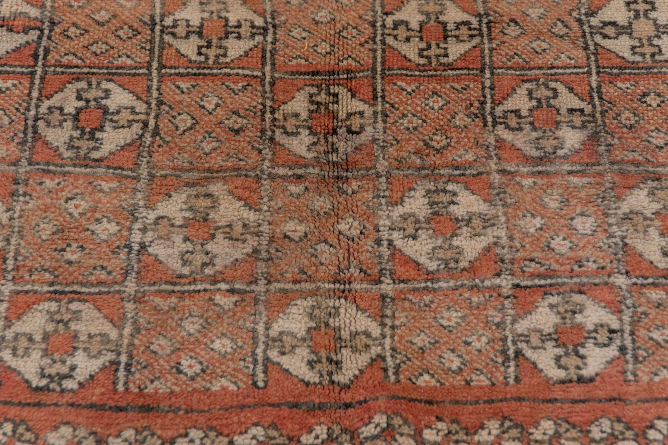 5' x 10' one-of-a-kind handmade vintage Moroccan medium size rug. Color palette: terra cotta, ivory, charcoal, camel, taupe