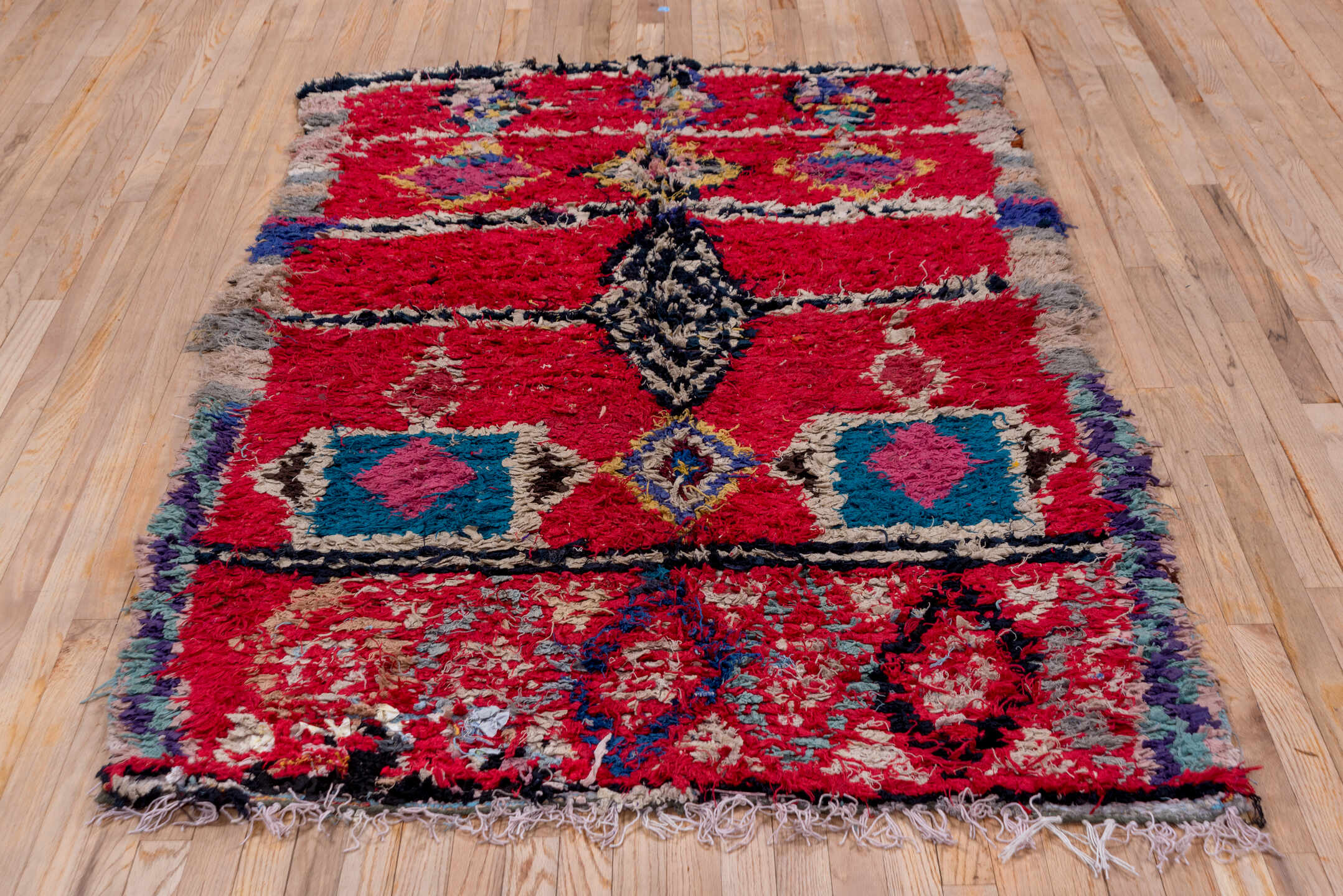 4' x 6' one-of-a-kind handmade vintage Moroccan small size rug. Color palette: crimson, ivory, charcoal, teal, pink, gray