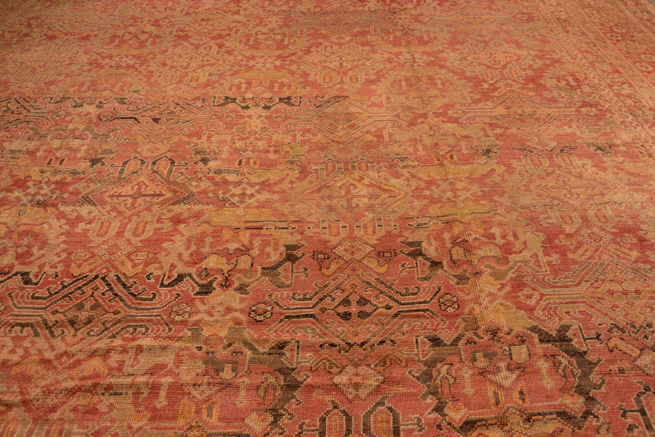 16' x 28' one-of-a-kind handmade antique Oushak oversize rug. Color palette: terra cotta, salmon, gold, rust, camel, brown