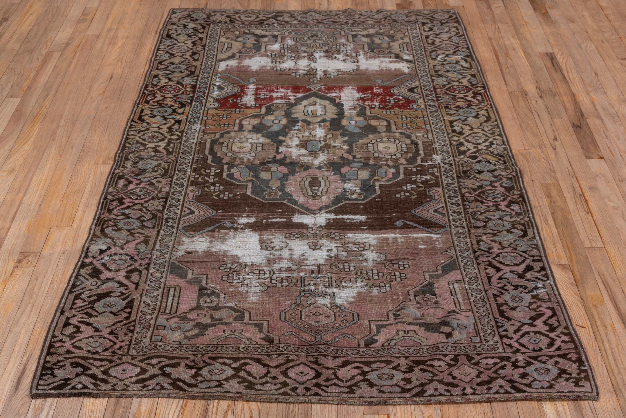 4' x 6' one-of-a-kind handmade antique Caucasian small size rug. Color palette: brown, rose, taupe, ivory, slate, burgundy
