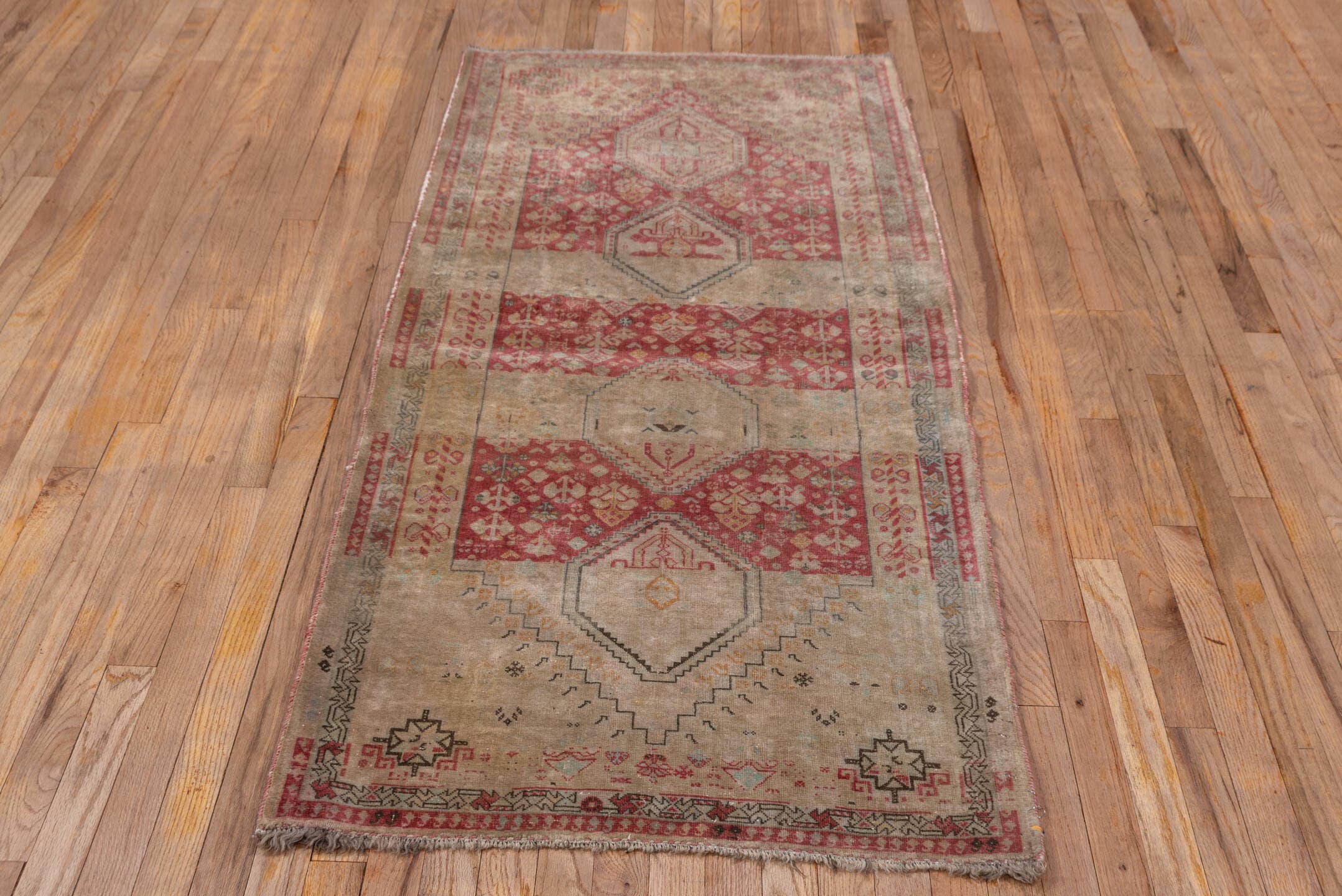 2' x 6' one-of-a-kind handmade antique Shiraz runner rug. Color palette: ivory, rust, taupe, rose, sage, charcoal