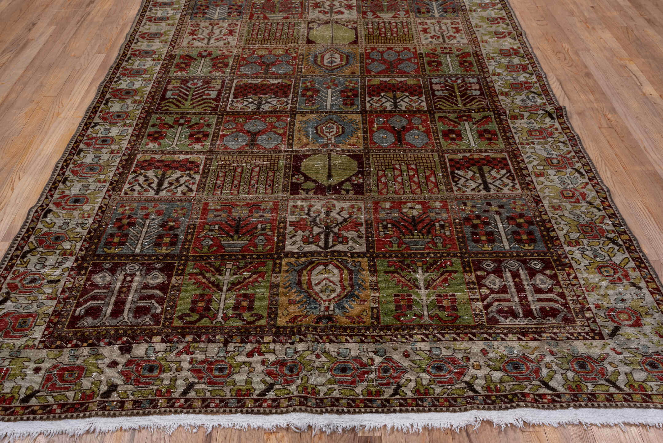 6' x 10' one-of-a-kind handmade antique Baktiary large size rug. Color palette: ivory, rust, olive, burgundy, blue, taupe