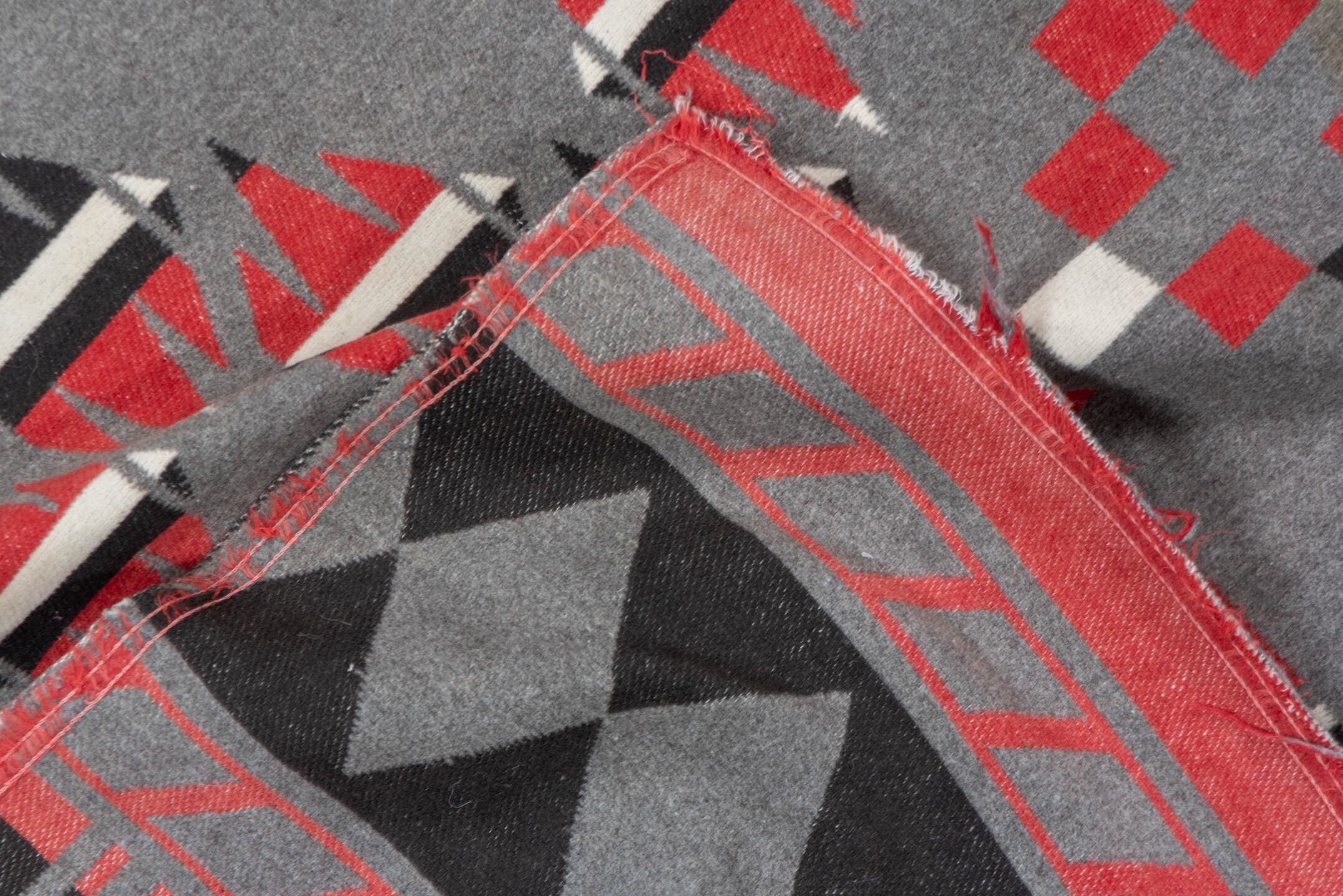 5' x 6' one-of-a-kind handmade vintage Blanket rug. Color palette: gray, charcoal, crimson, ivory, taupe, black, red, beige