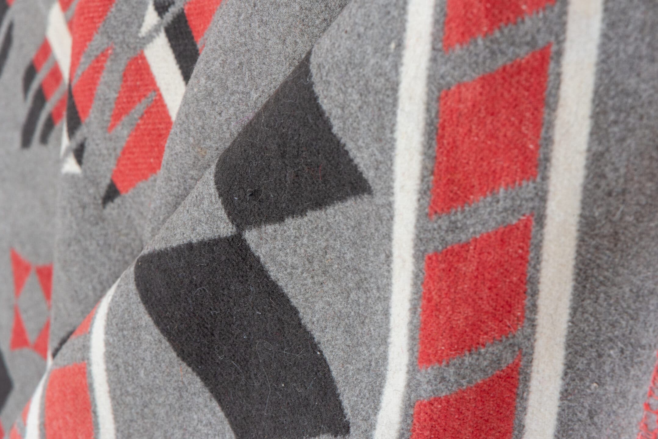 5' x 6' one-of-a-kind handmade vintage Blanket rug. Color palette: gray, charcoal, crimson, ivory, taupe, black, red, beige