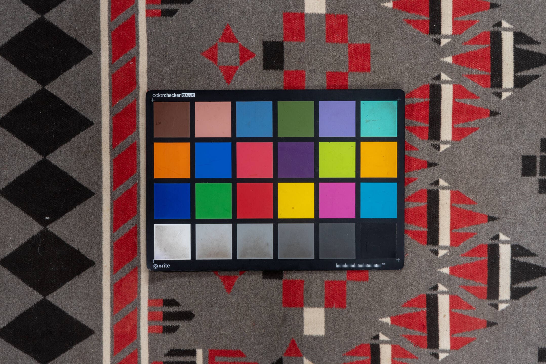 5' x 6' one-of-a-kind handmade vintage Blanket rug. Color palette: gray, charcoal, crimson, ivory, taupe, black, red, beige