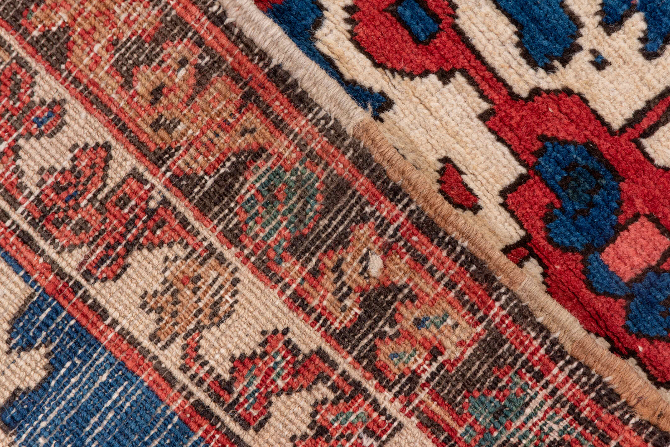 15' x 20' one-of-a-kind handmade antique Serapi oversize rug. Color palette: terra cotta, indigo, ivory, rust, coral, navy