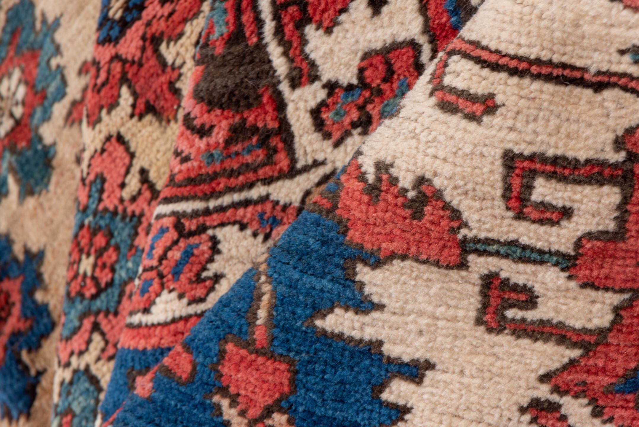 15' x 20' one-of-a-kind handmade antique Serapi oversize rug. Color palette: terra cotta, indigo, ivory, rust, coral, navy