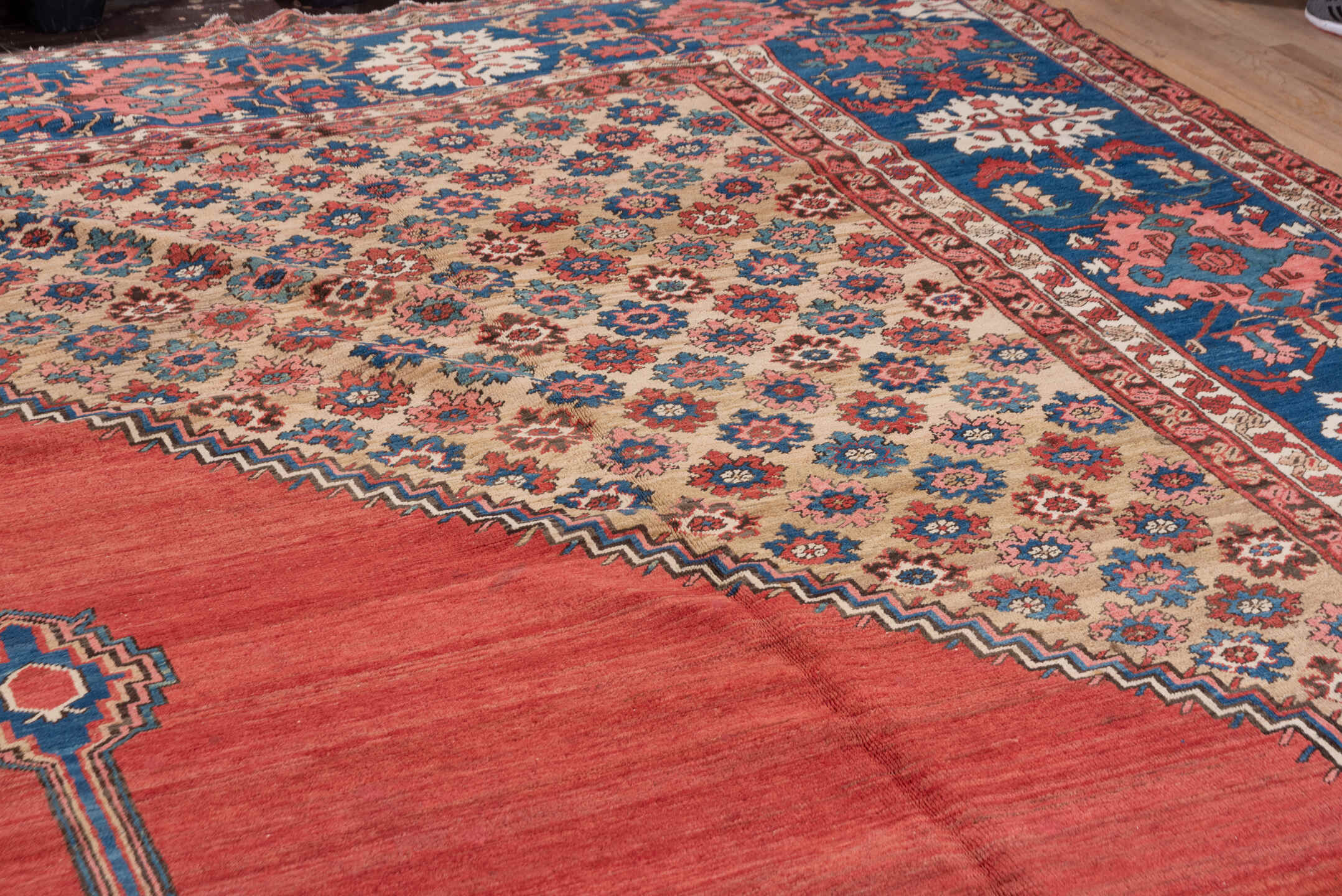 15' x 20' one-of-a-kind handmade antique Serapi oversize rug. Color palette: terra cotta, indigo, ivory, rust, coral, navy