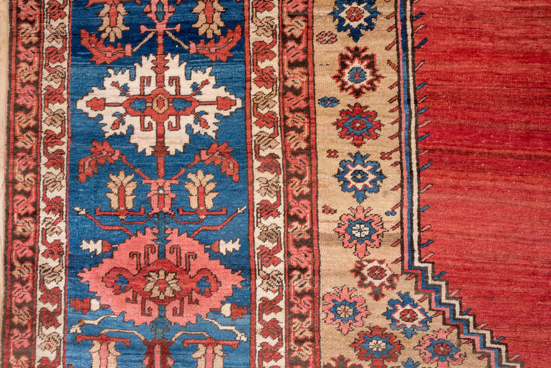 15' x 20' one-of-a-kind handmade antique Serapi oversize rug. Color palette: terra cotta, indigo, ivory, rust, coral, navy