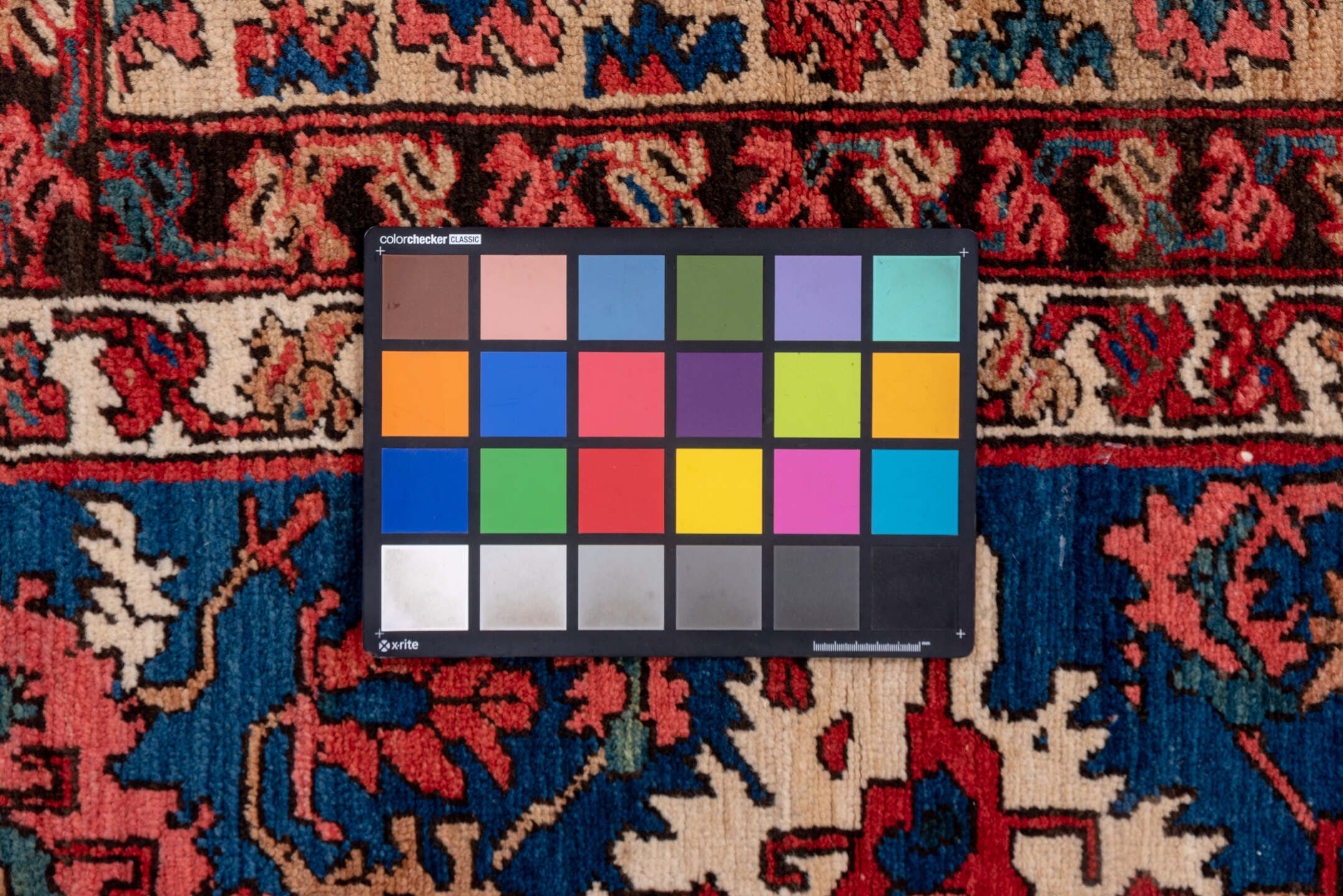 15' x 20' one-of-a-kind handmade antique Serapi oversize rug. Color palette: terra cotta, indigo, ivory, rust, coral, navy