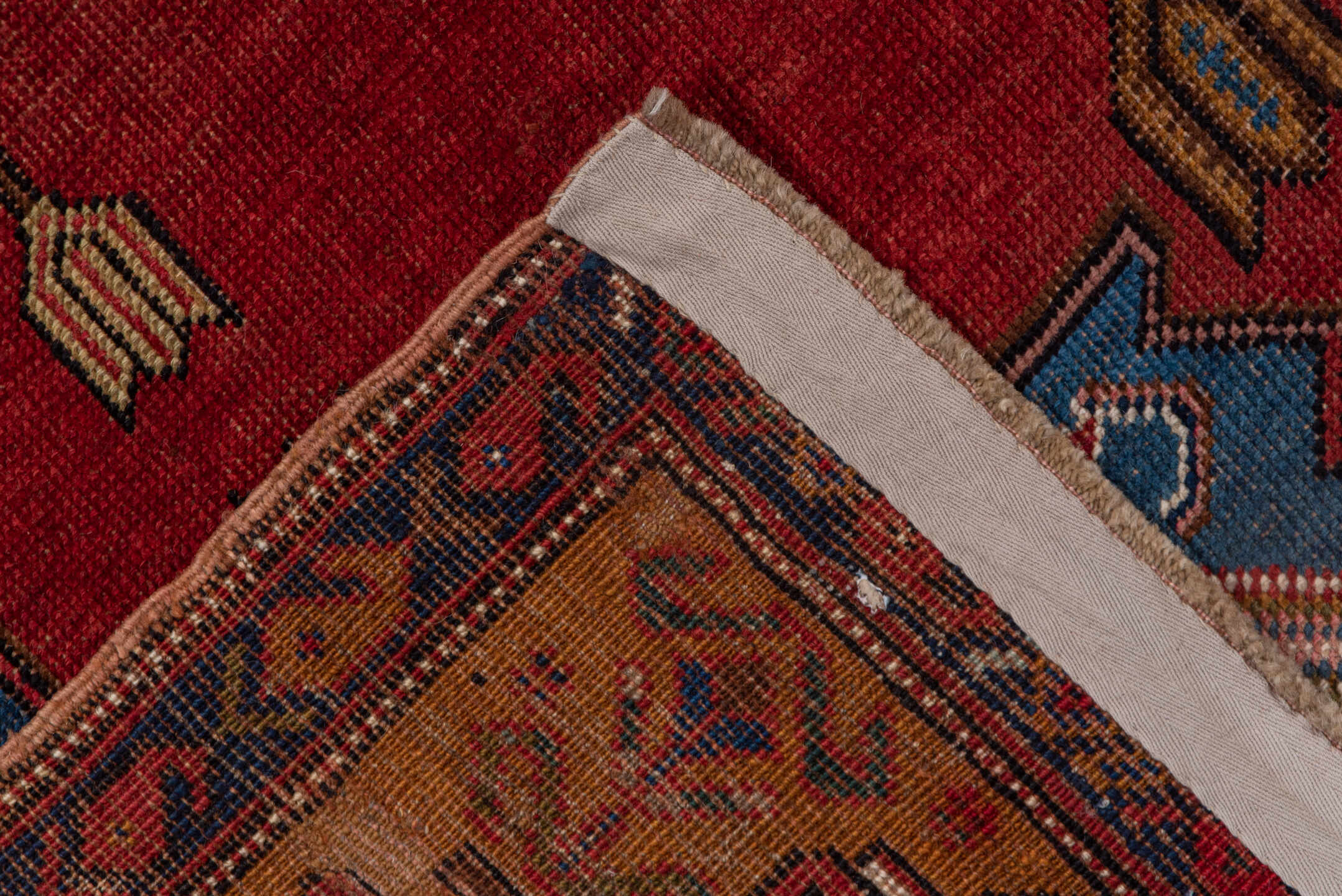 5' x 6' one-of-a-kind handmade vintage Caucasian rug. Color palette: blue, brown, gray, pink, red
