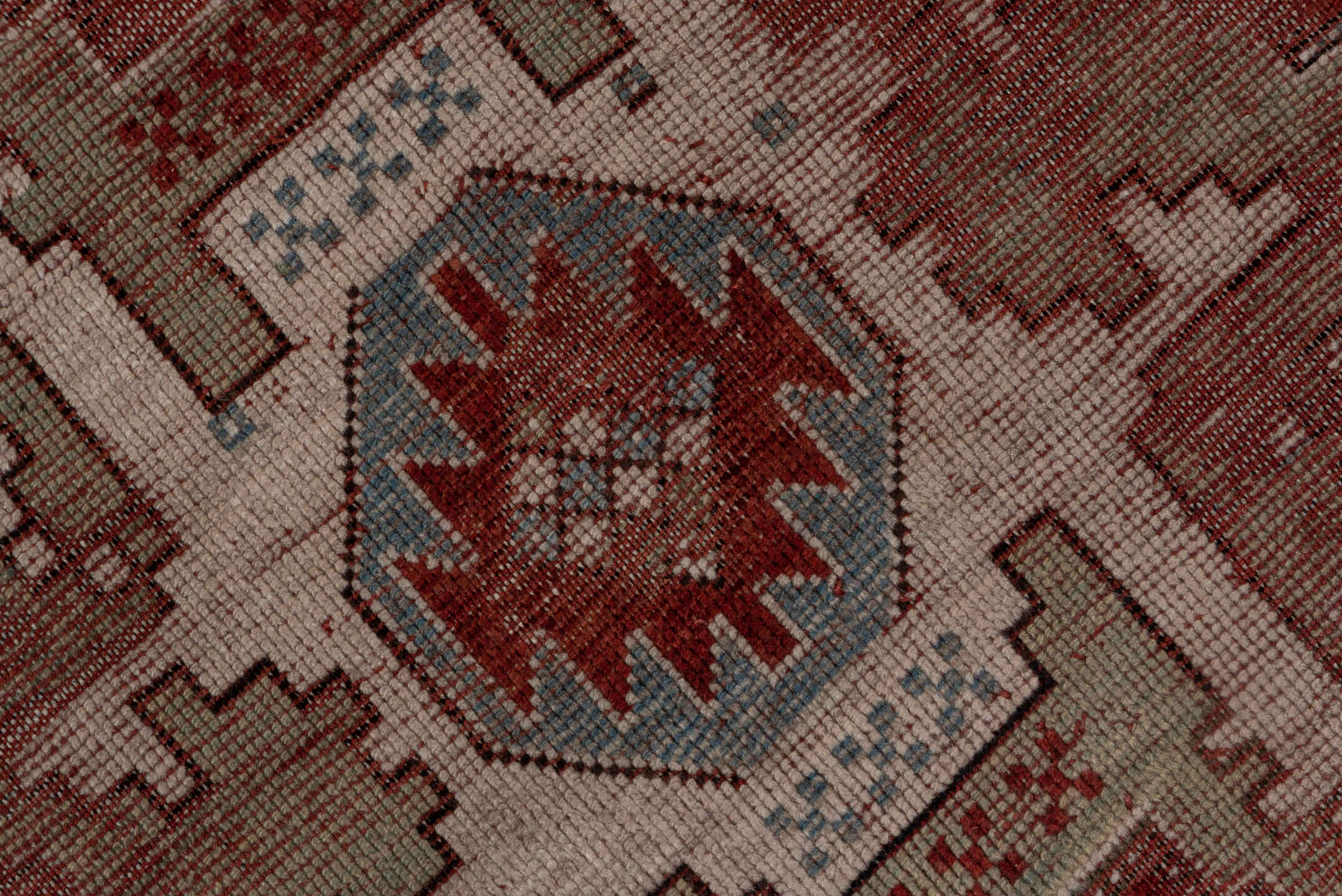 4' x 9' one-of-a-kind handmade antique Kazak runner rug. Color palette: rust, ivory, soft blue, brick, taupe, burgundy
