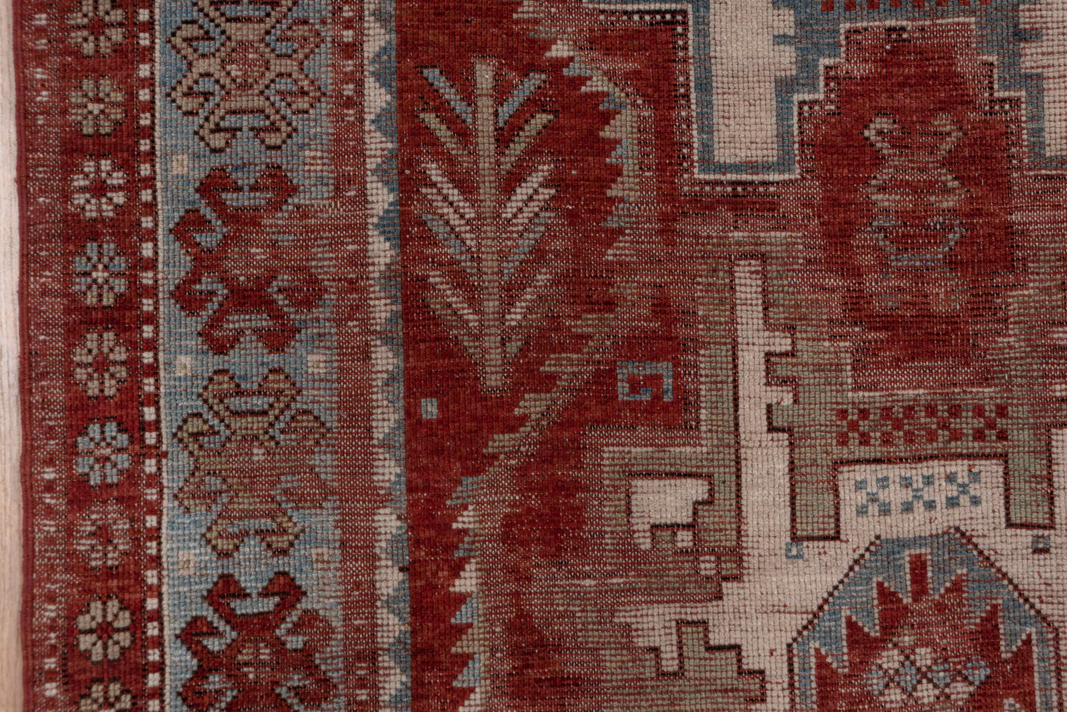 4' x 9' one-of-a-kind handmade antique Kazak runner rug. Color palette: rust, ivory, soft blue, brick, taupe, burgundy