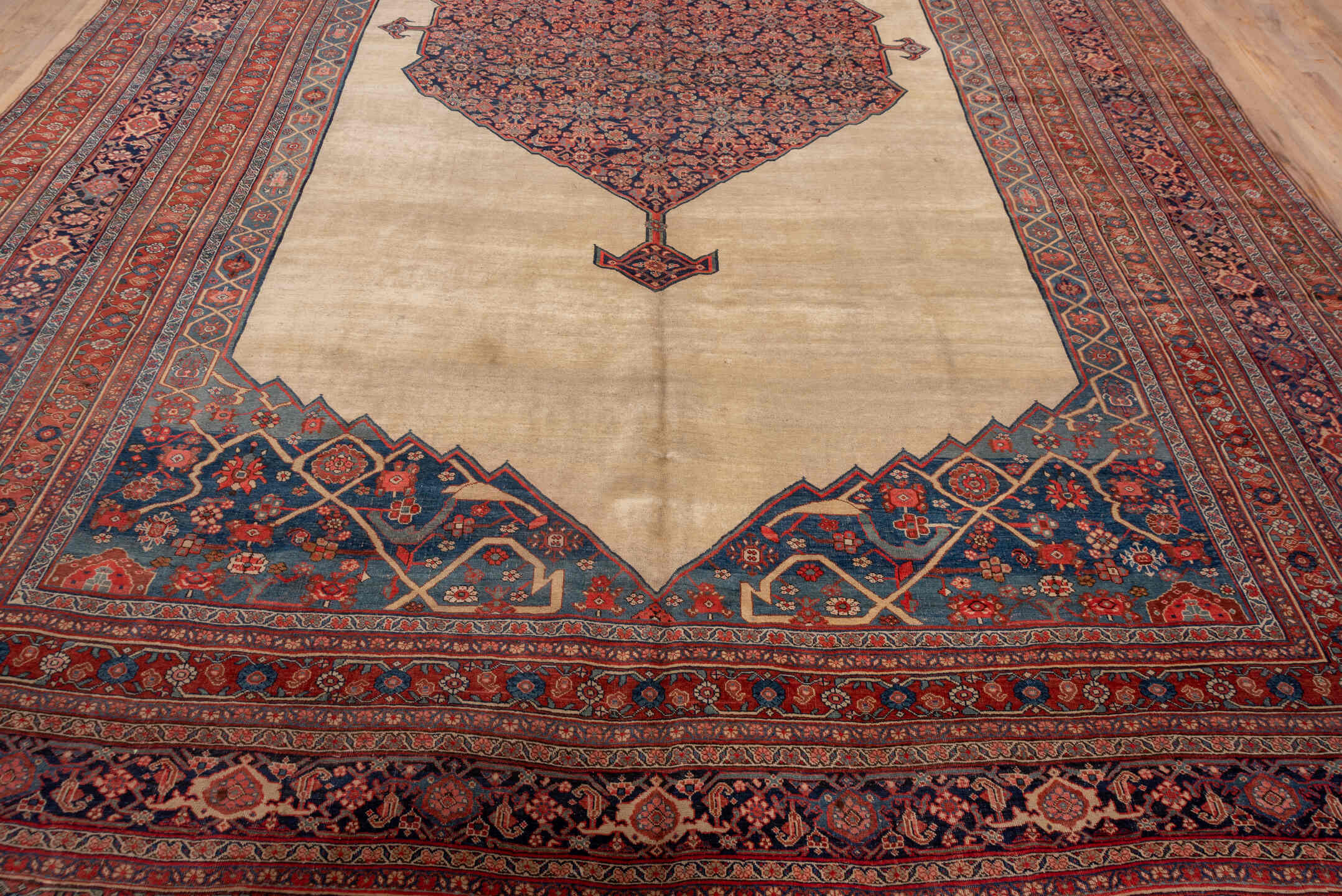 11' x 17' one-of-a-kind handmade antique Bidjar oversize rug. Color palette: ivory, rust, indigo, terracotta, navy, camel