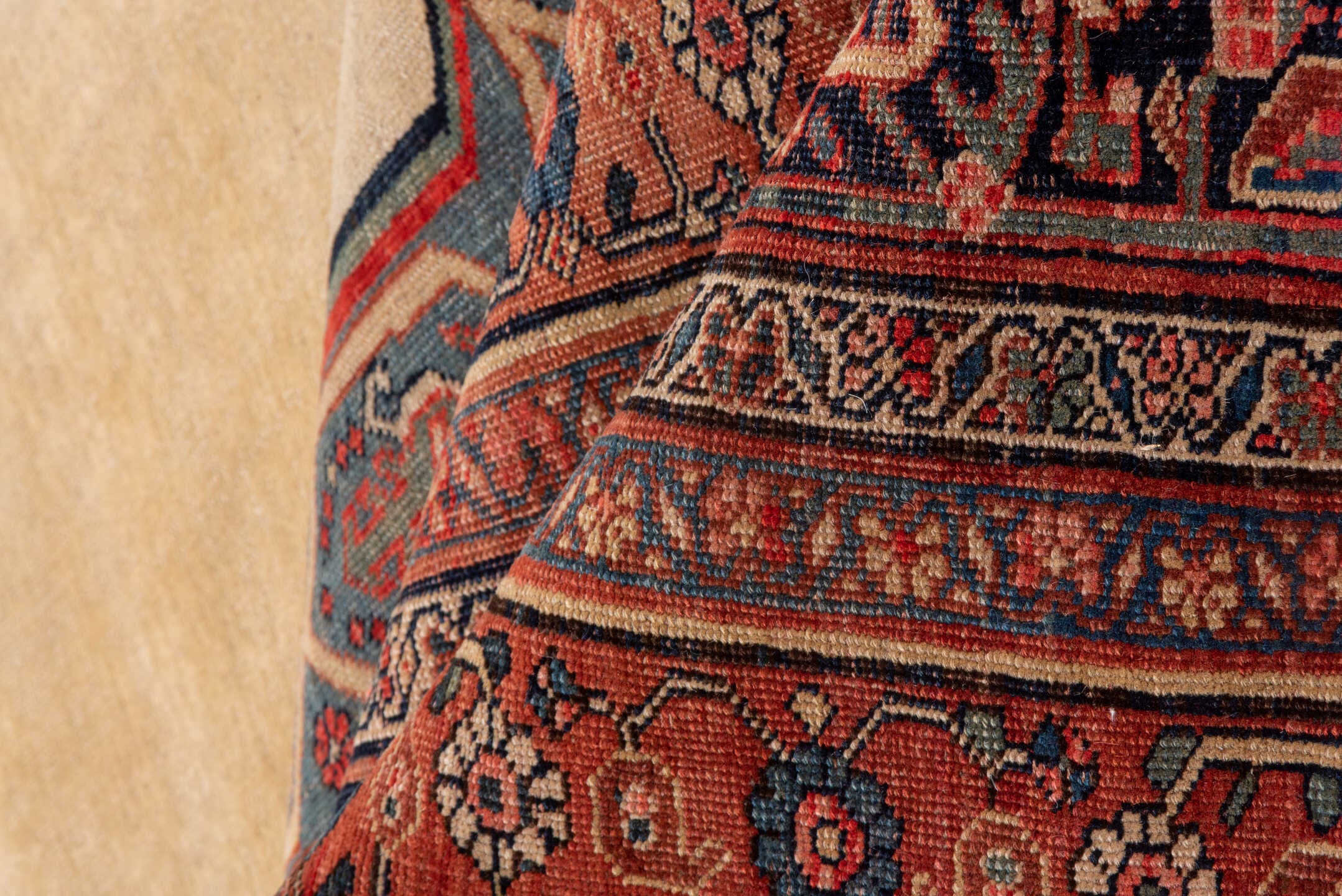 11' x 17' one-of-a-kind handmade antique Bidjar oversize rug. Color palette: ivory, rust, indigo, terracotta, navy, camel
