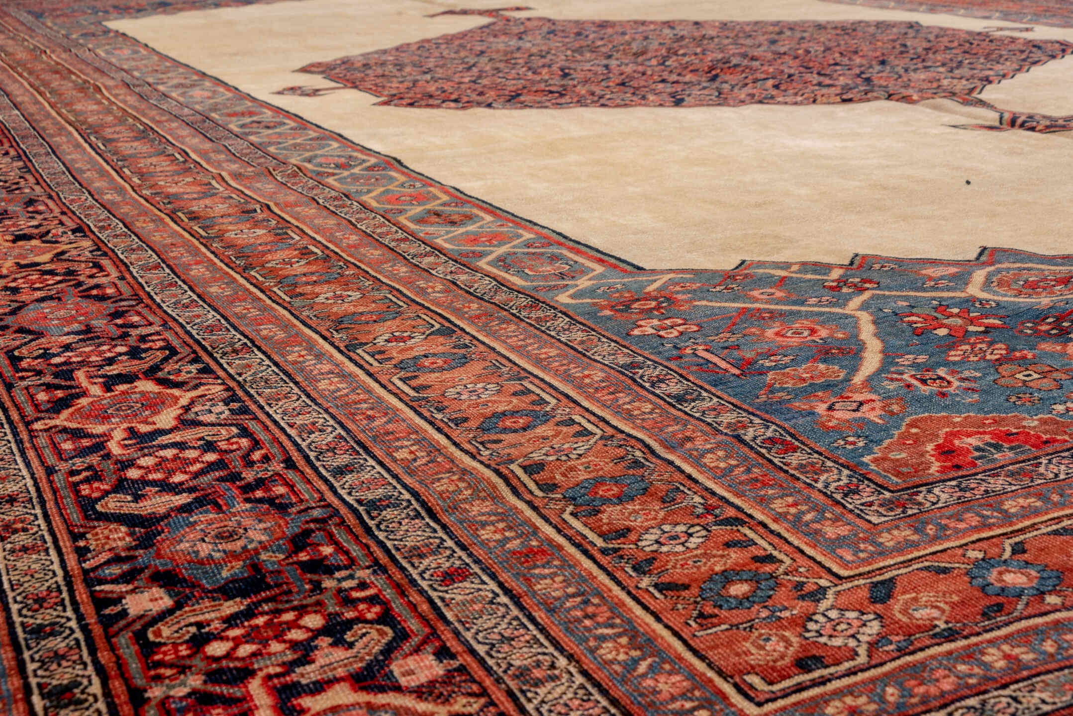 11' x 17' one-of-a-kind handmade antique Bidjar oversize rug. Color palette: ivory, rust, indigo, terracotta, navy, camel