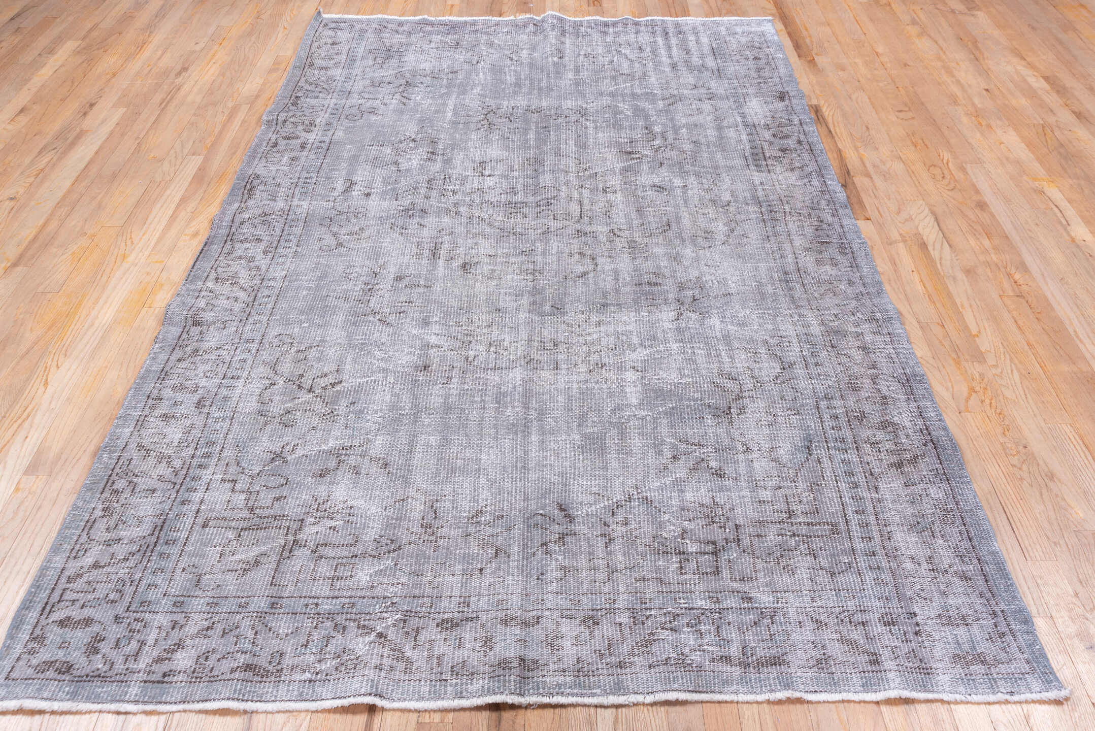 5' x 9' one-of-a-kind handmade vintage Overdyed medium size rug. Color palette: gray, taupe, charcoal, ivory, beige, black