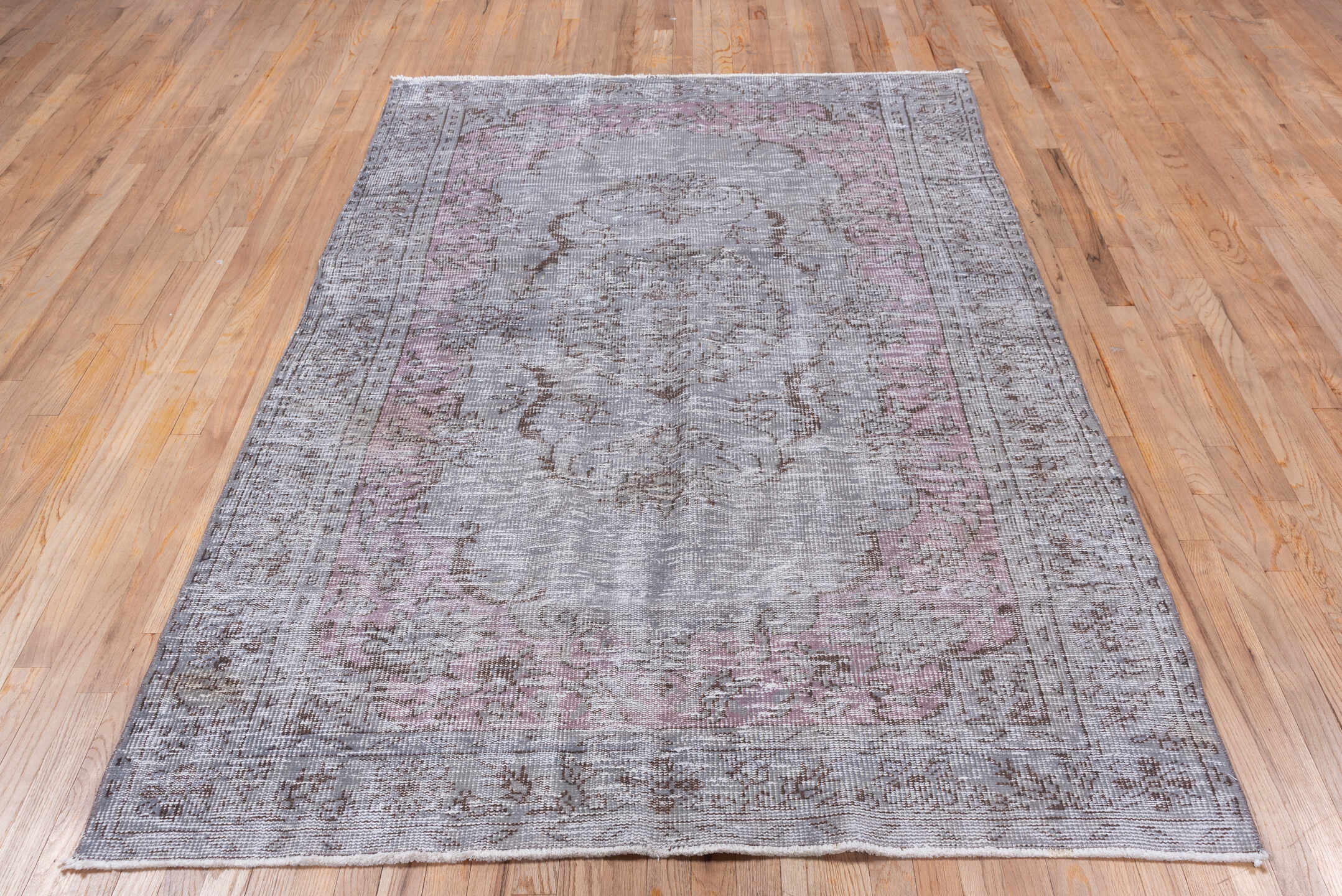 5' x 8' one-of-a-kind handmade vintage Overdyed medium size rug. Color palette: gray, taupe, dusty rose, ivory, mauve, beige