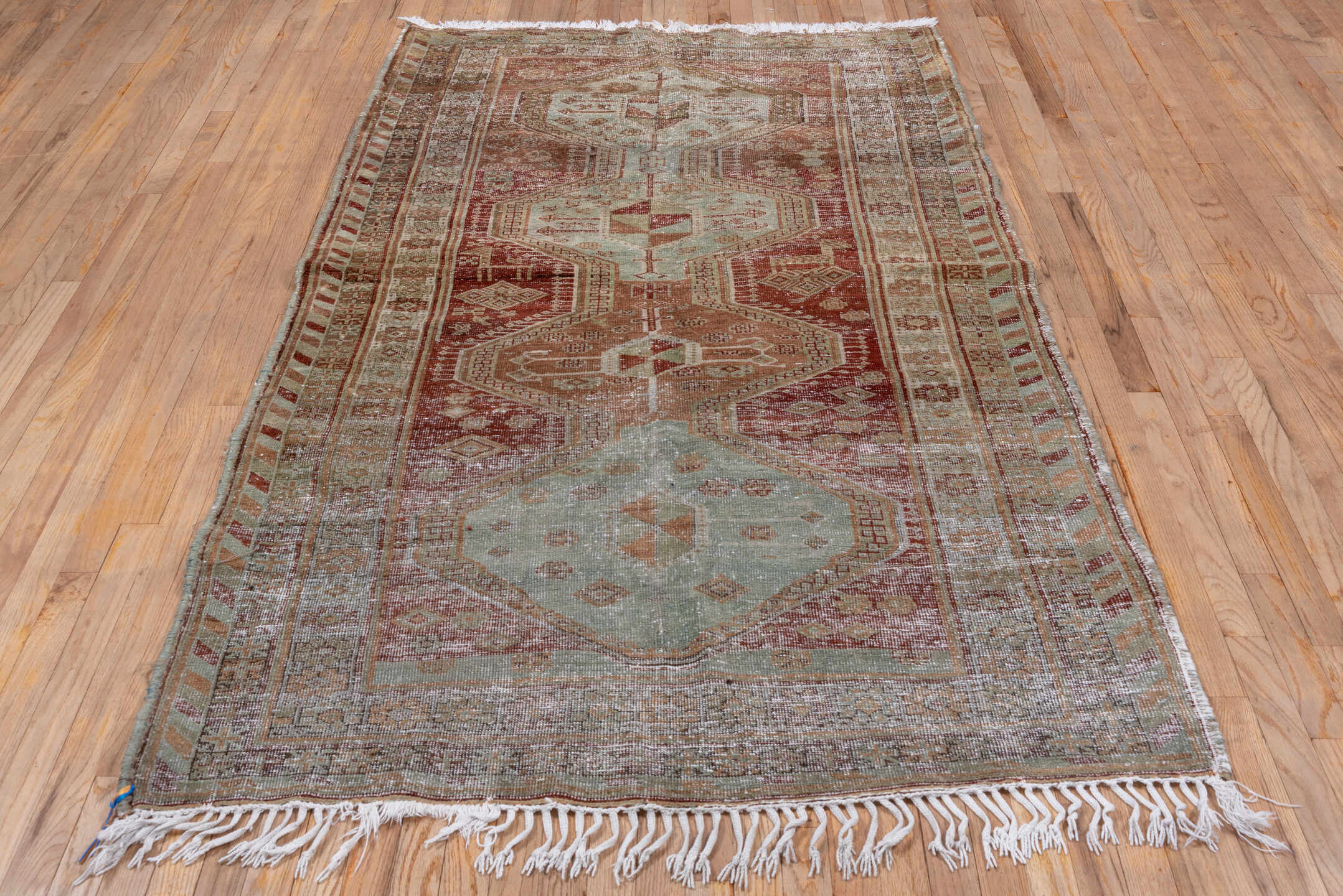4' x 8' one-of-a-kind handmade vintage Trans Caucasian rug. Color palette: rust, sage, taupe, ivory, terra cotta, brown