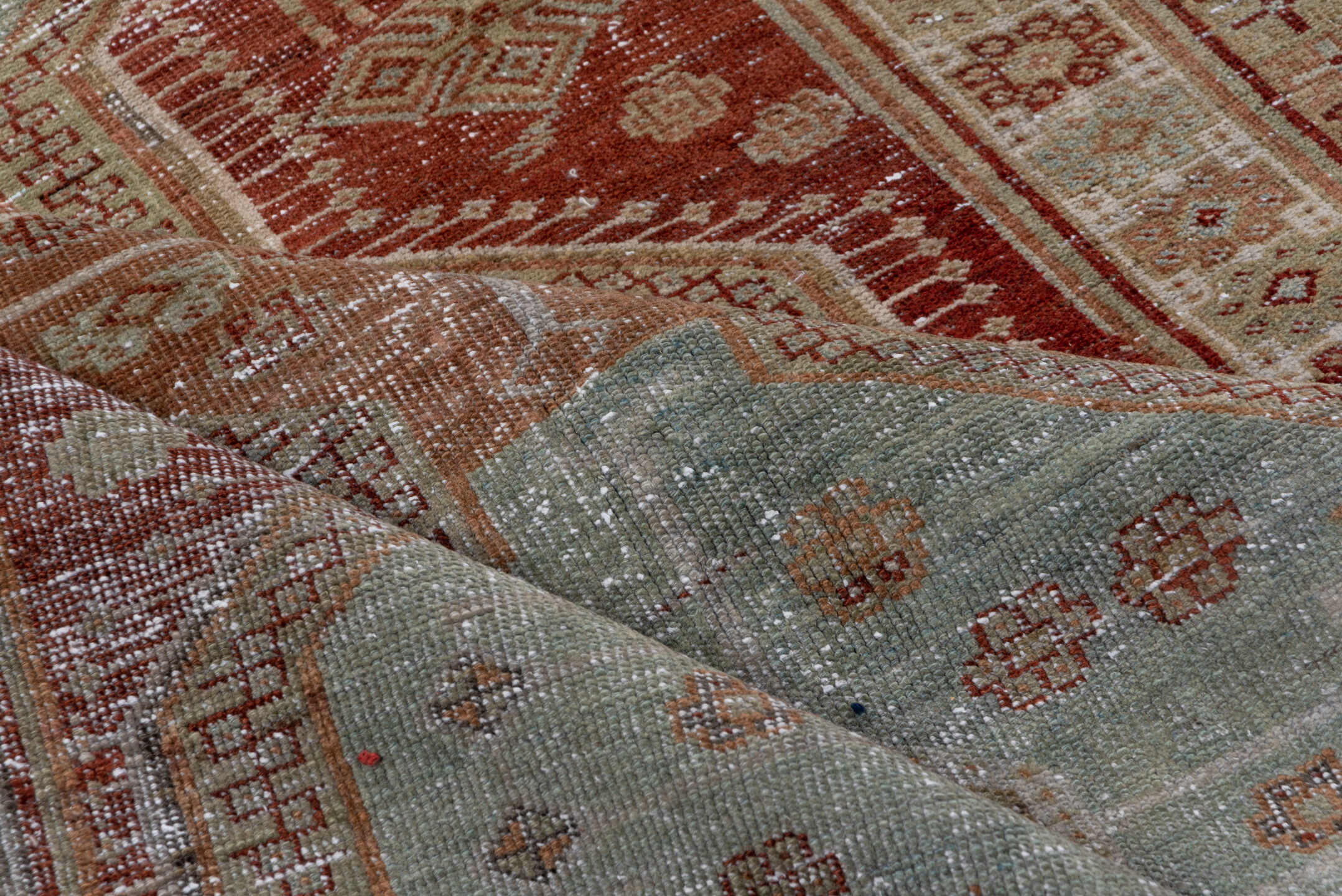 4' x 8' one-of-a-kind handmade vintage Trans Caucasian rug. Color palette: rust, sage, taupe, ivory, terra cotta, brown