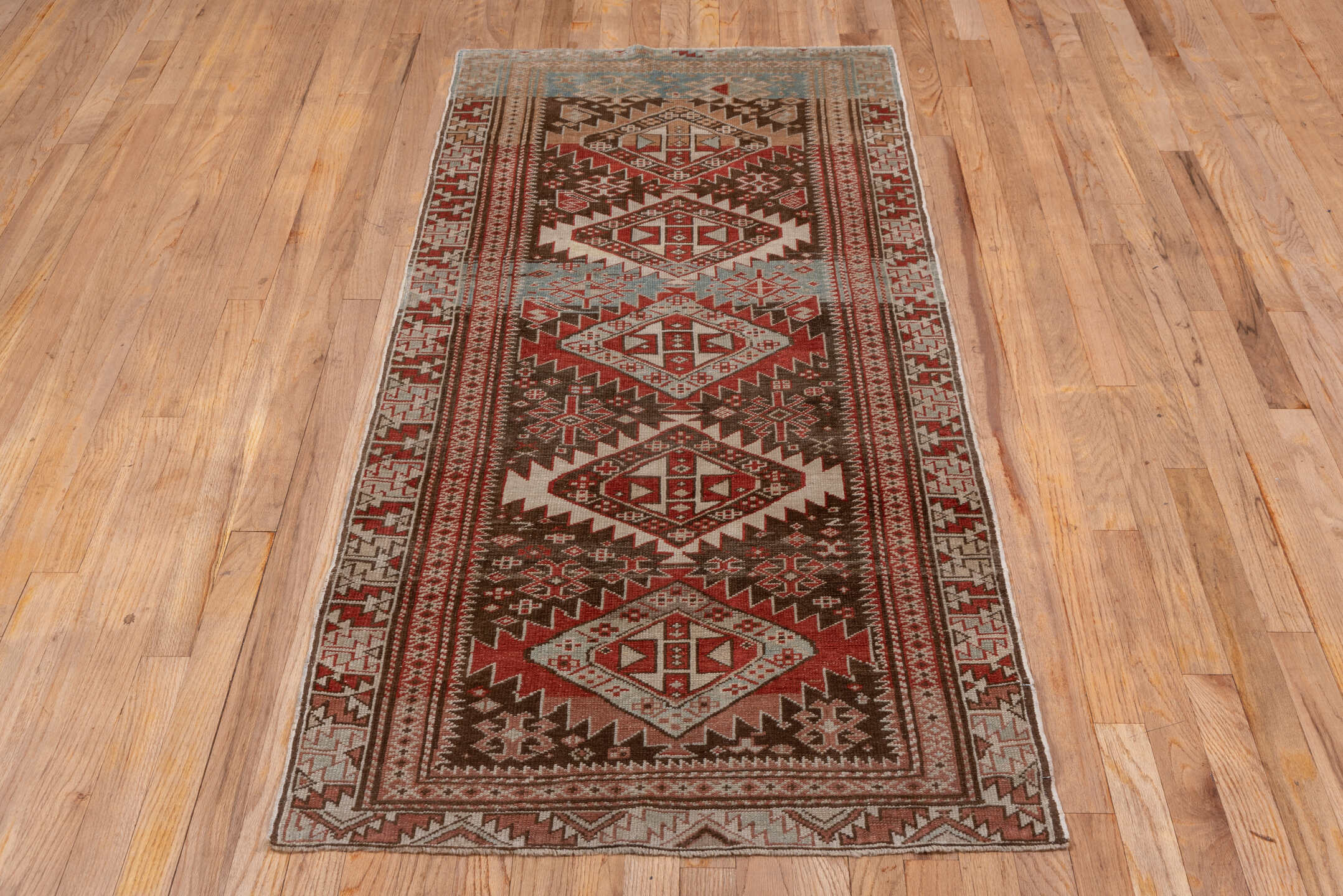 2' x 6' one-of-a-kind handmade antique Shirvan runner rug. Color palette: brown, rust, ivory, pale blue, taupe, brick, camel