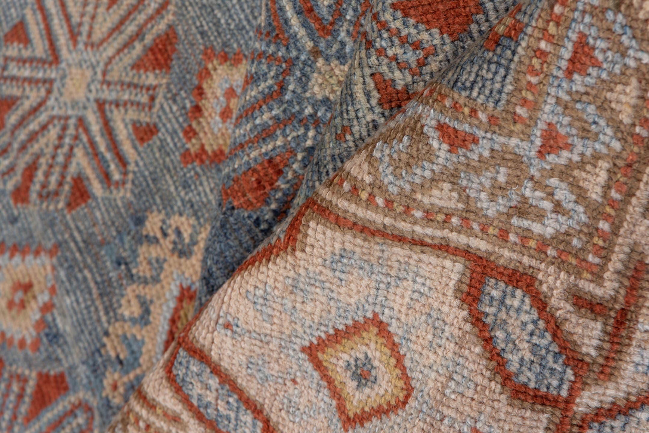 4' x 9' one-of-a-kind handmade antique Caucasian runner rug. Color palette: blue, ivory, rust, taupe, slate, camel