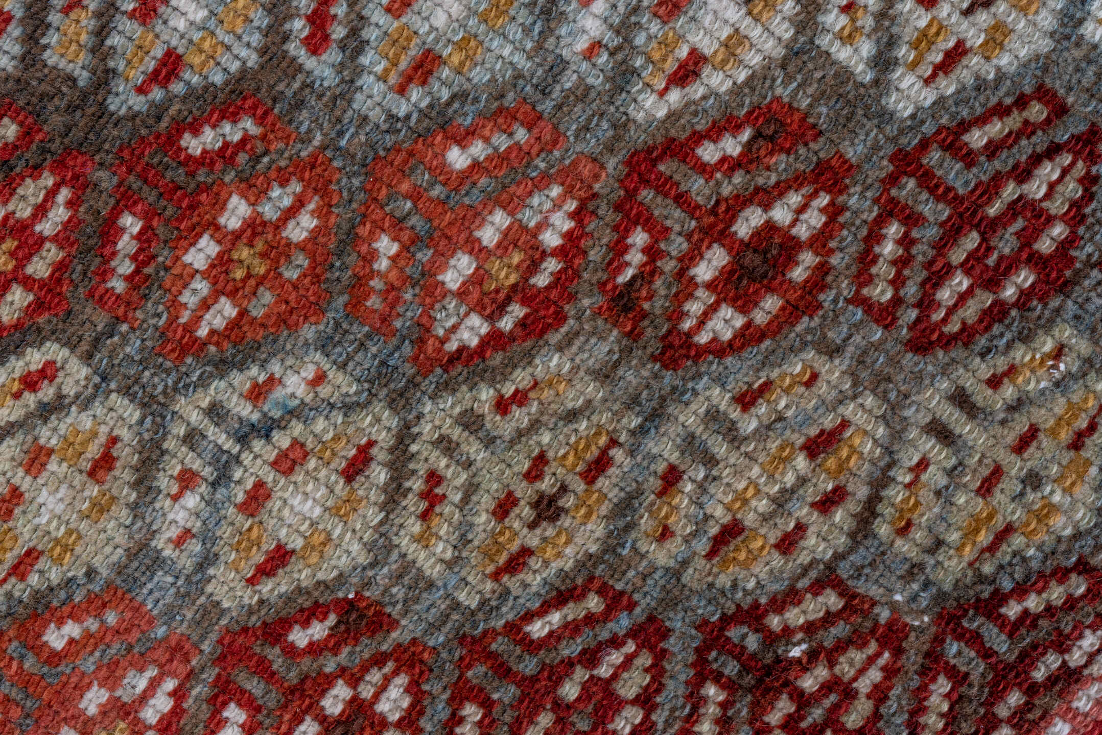 3' x 7' one-of-a-kind handmade antique Kurd rug. Color palette: rust, ivory, sky blue, camel, olive, brown, brick, slate